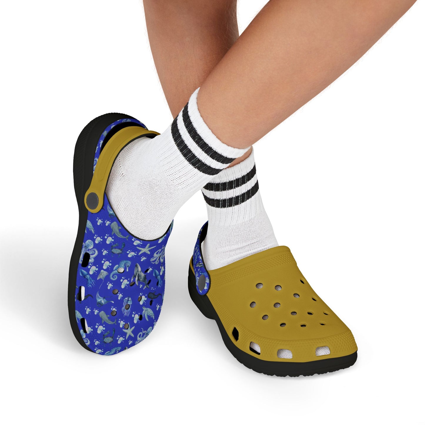 Kids' sea-themed clogs with blue printed upper and yellow side, worn with white socks