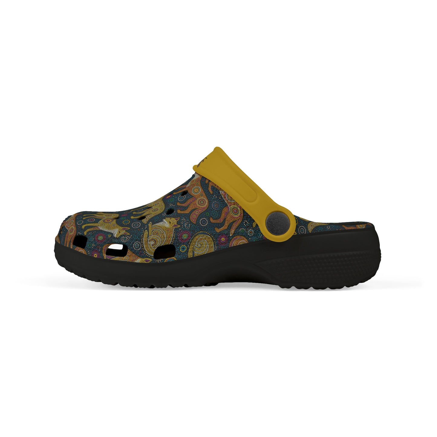 Aboriginal art casual clog shoe side view, dark patterned upper with yellow strap, black sole