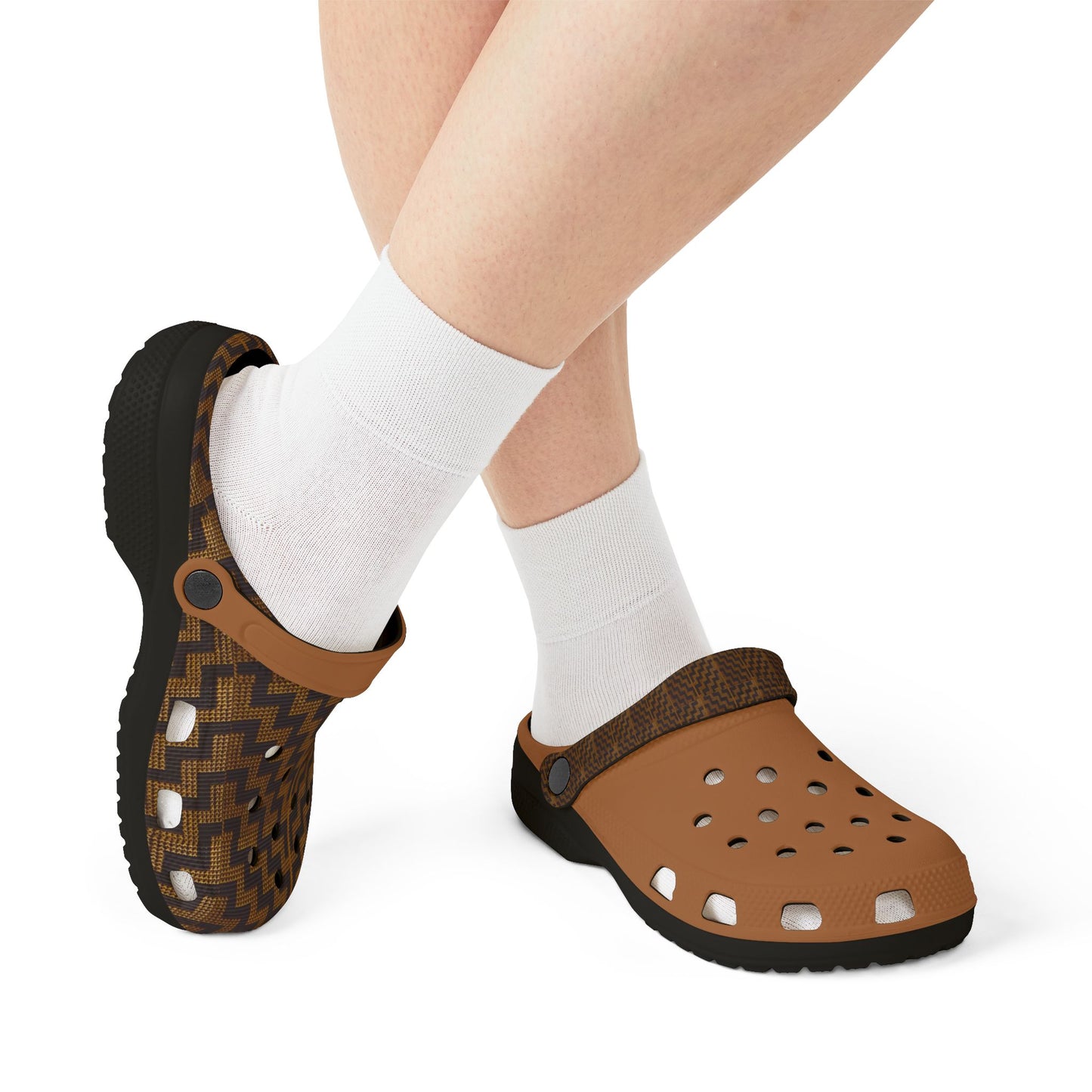 Tukutuku clog sandals worn with white socks: dark patterned clog and tan perforated clog