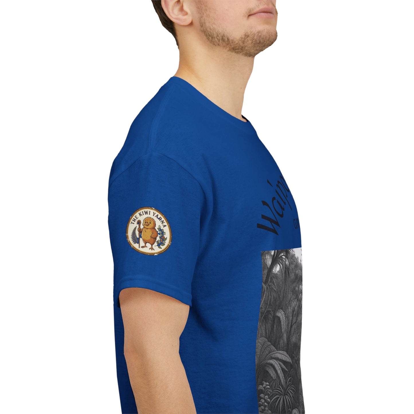 Blue crewneck T-shirt showing left sleeve patch and side forest graphic print