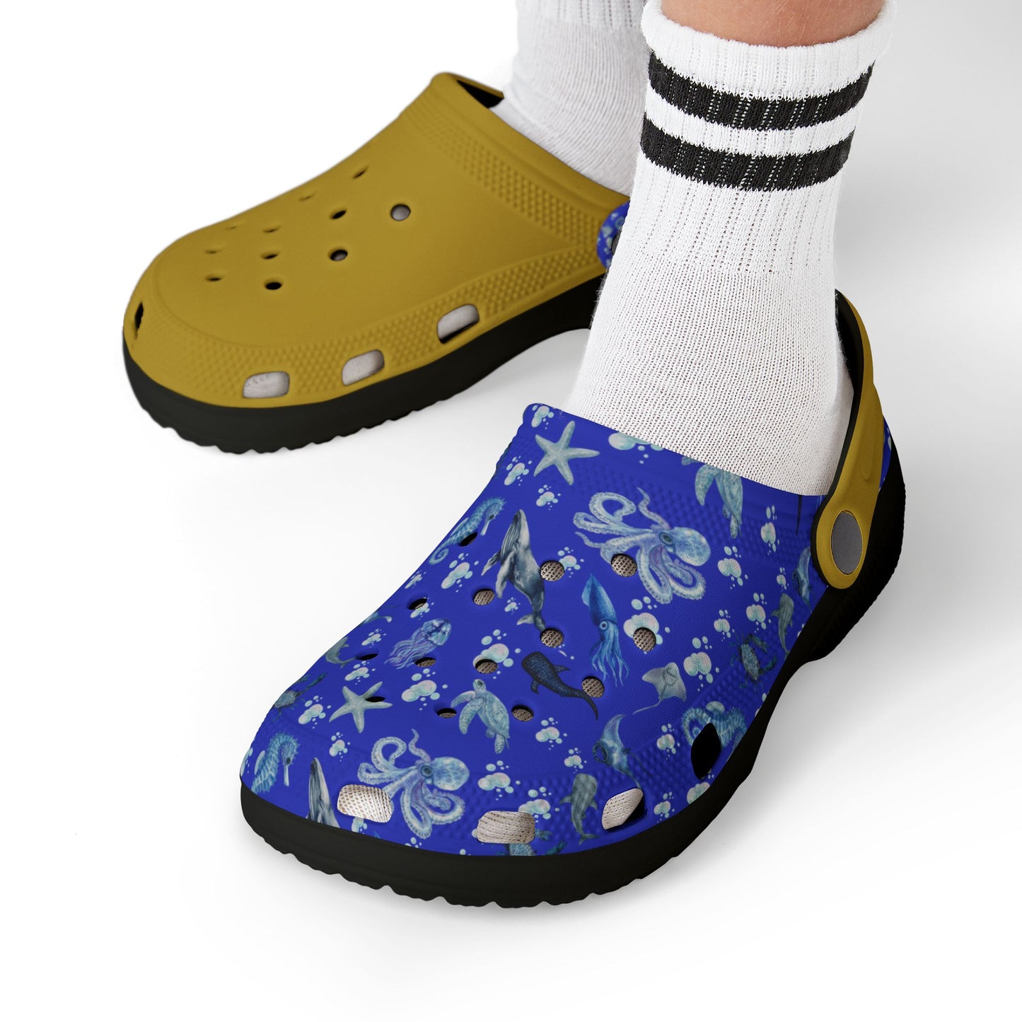 Kids' sea-themed clogs worn with white socks; blue ocean print and yellow upper