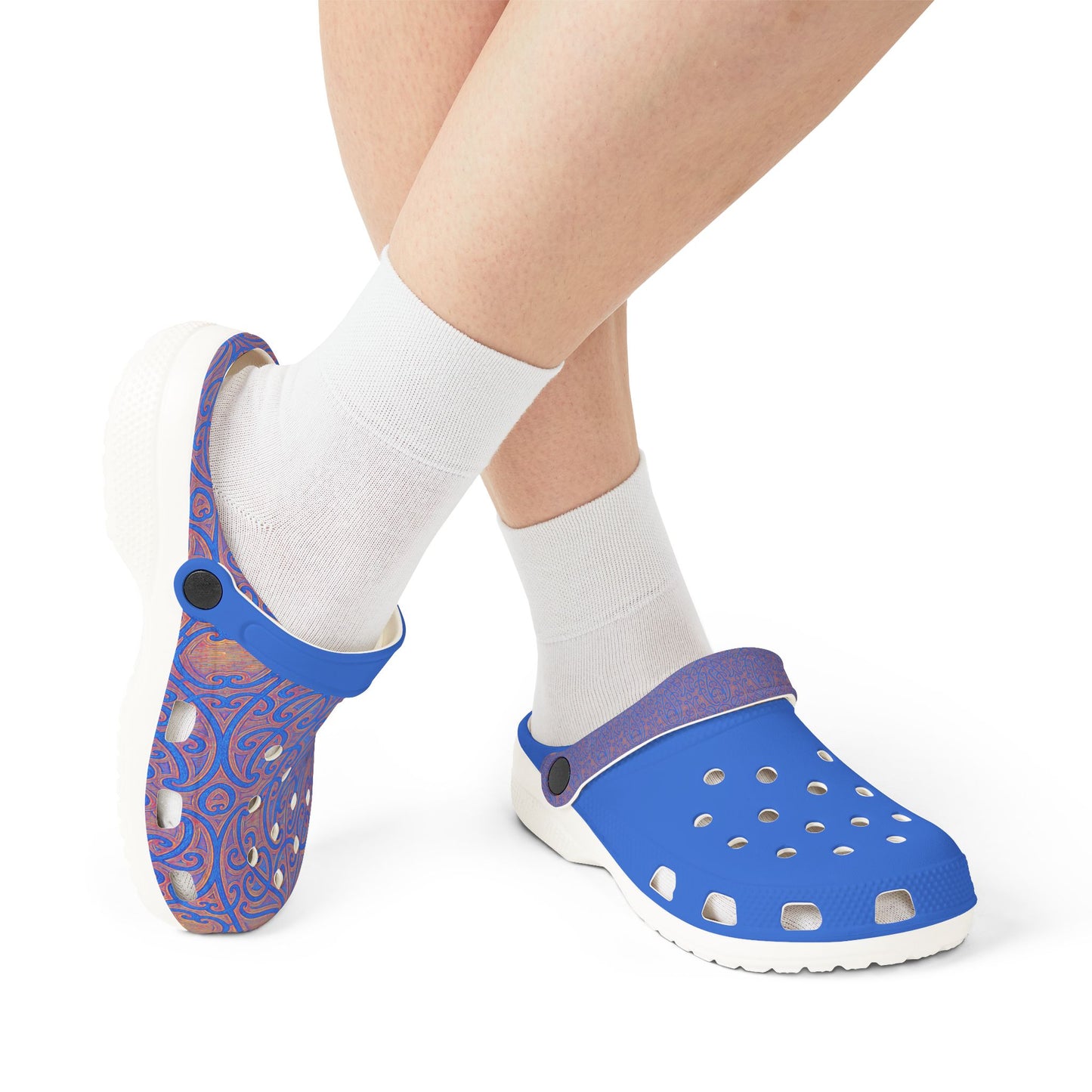 Māpouriki slip-on clogs worn with white socks; patterned and solid blue pair