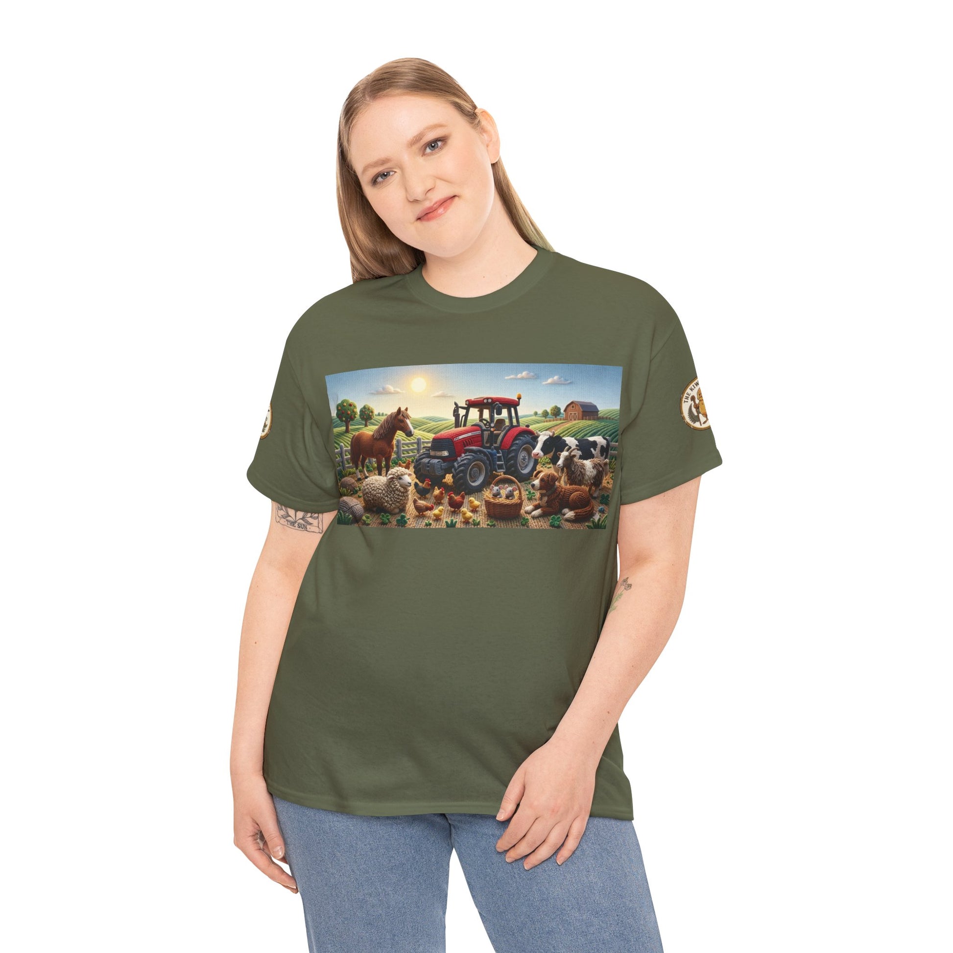 Olive green T-shirt on model with farm tractor scene graphic and sleeve logo patch.