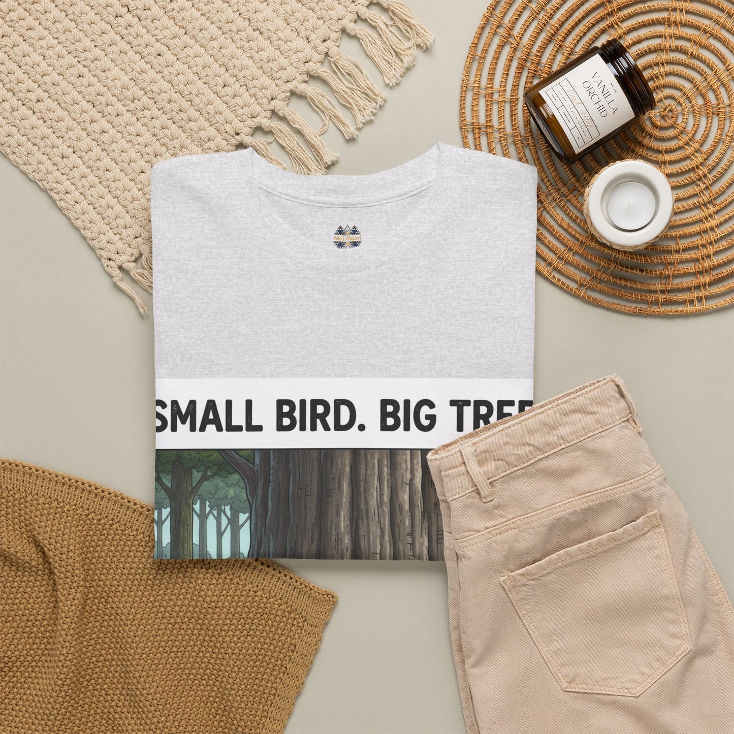 Light gray crewneck T-shirt with small chest logo and partial forest graphic