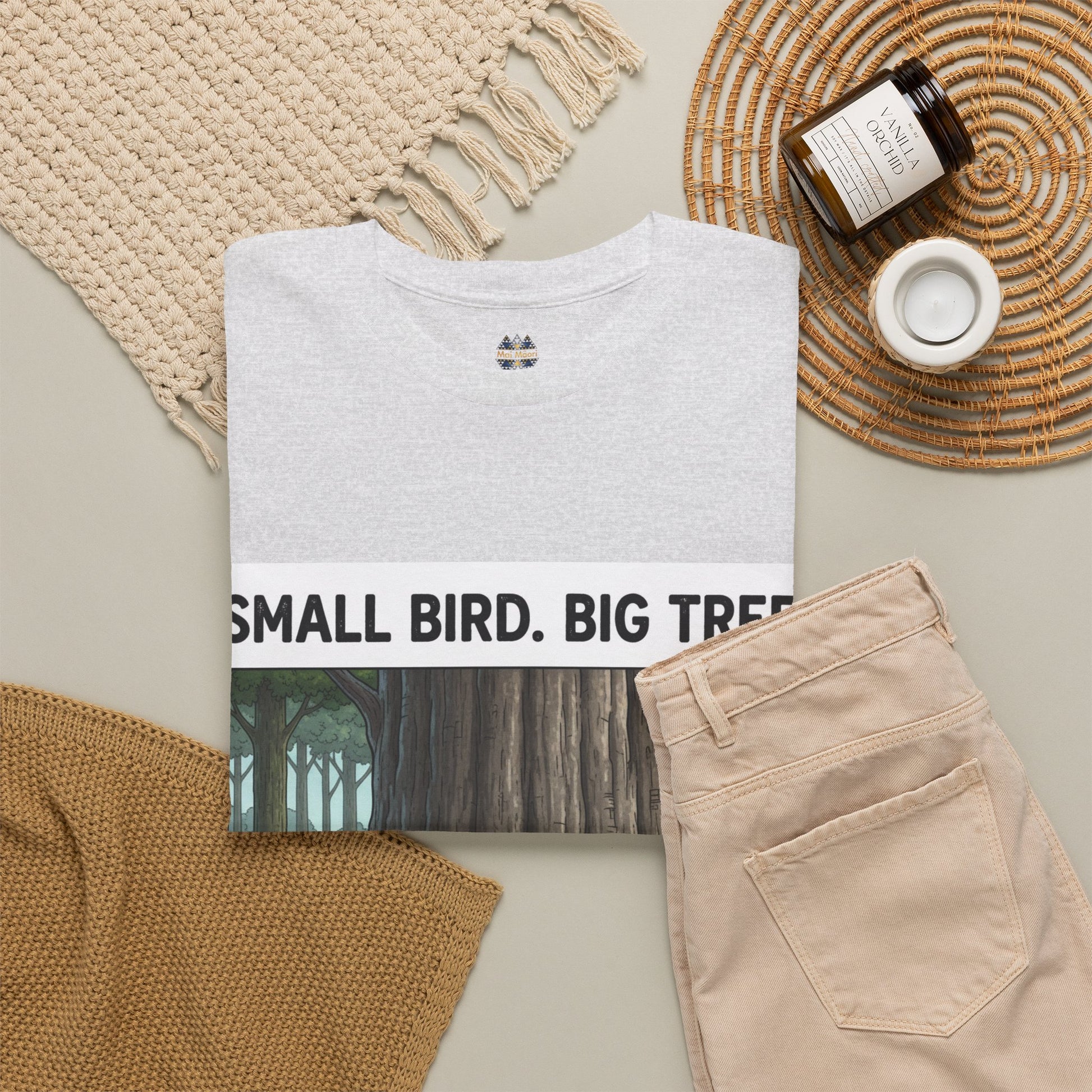 Light gray crewneck T-shirt with small chest logo and partial forest graphic