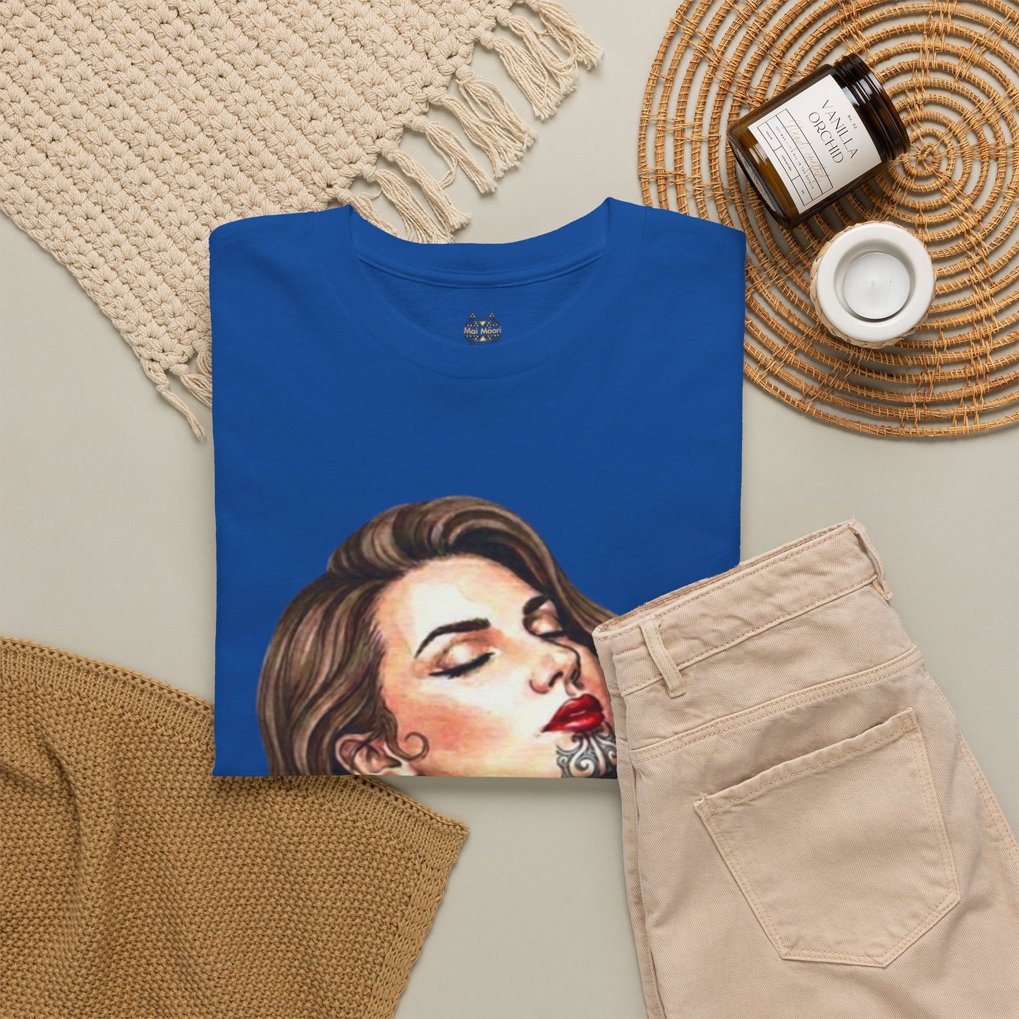 Royal blue graphic T-shirt laid flat, showing back portrait print and crew neckline.