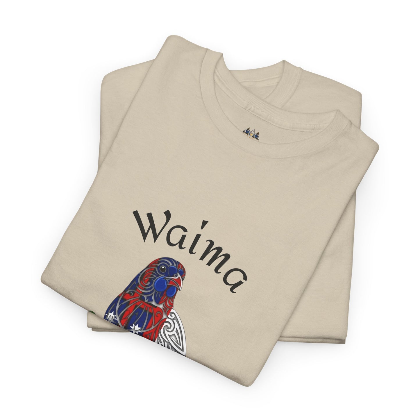 Folded natural T-shirt with Waima text and bird graphic