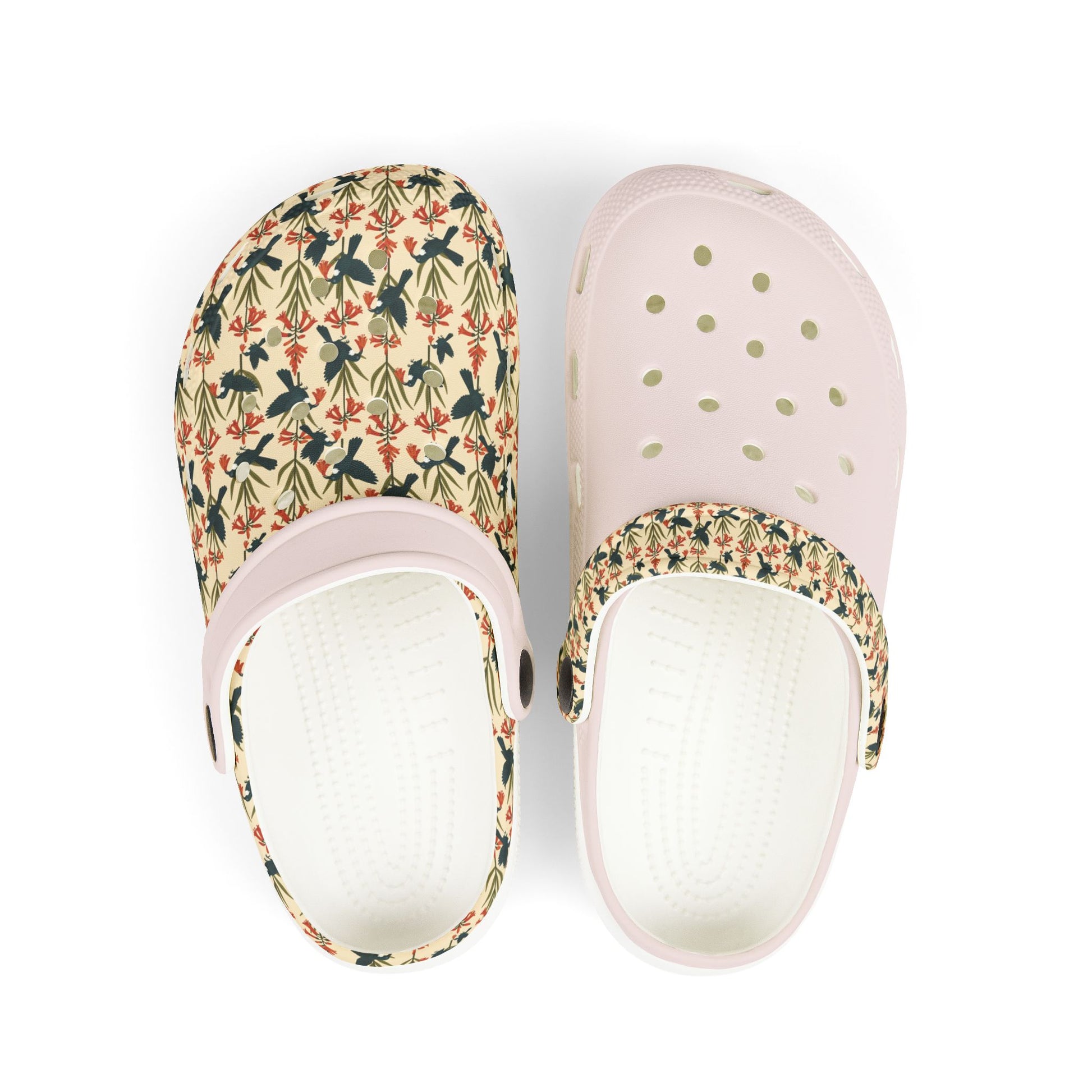 Kids slip-on clog shoes with colorful floral print, perforated vents, light pink sole.