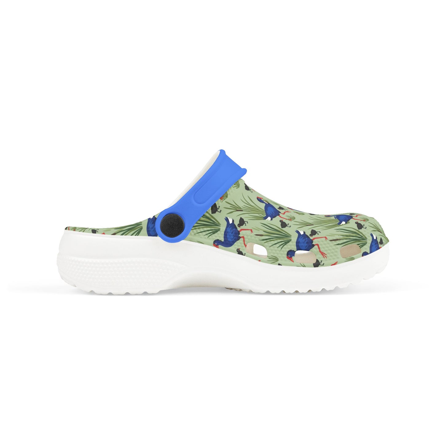 Kids side-view clog shoes with blue heel strap, green animal print upper, white sole.