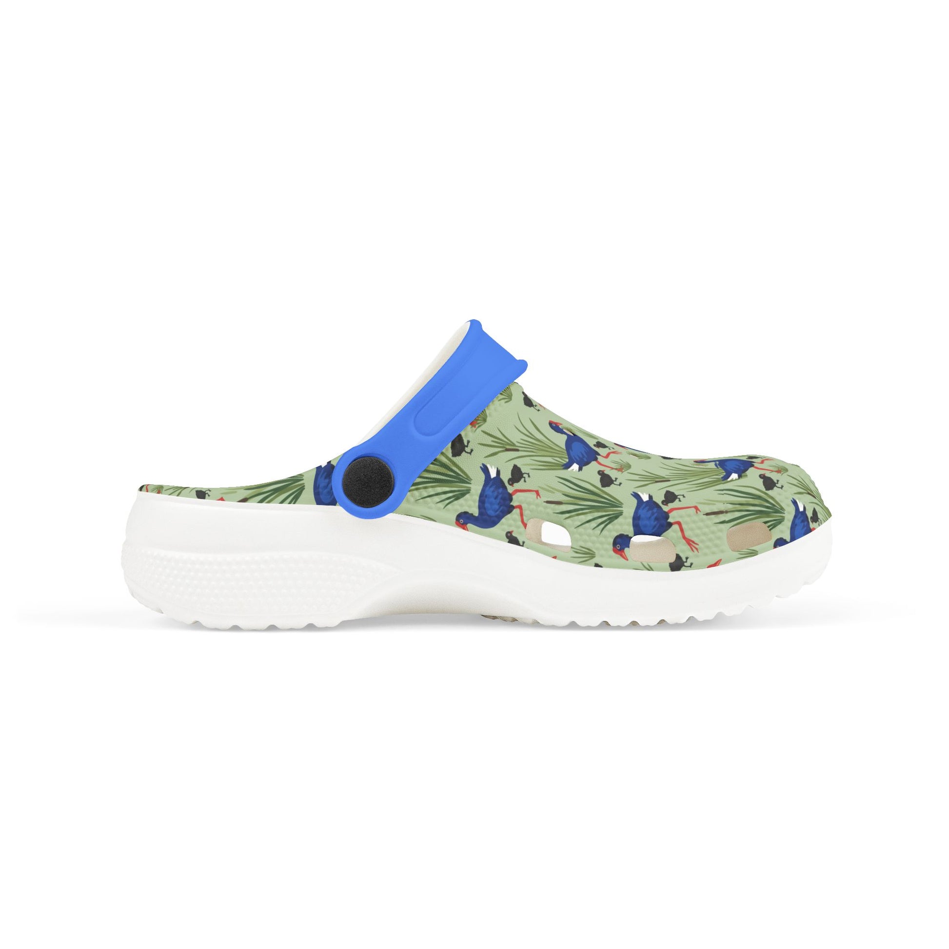 Kids side-view clog shoes with blue heel strap, green animal print upper, white sole.