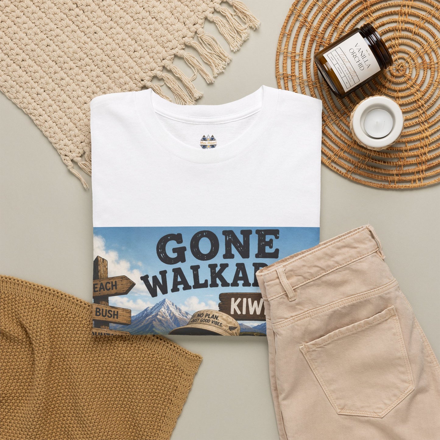 White T-shirt with front kiwi graphic print, shown with other items cropped out