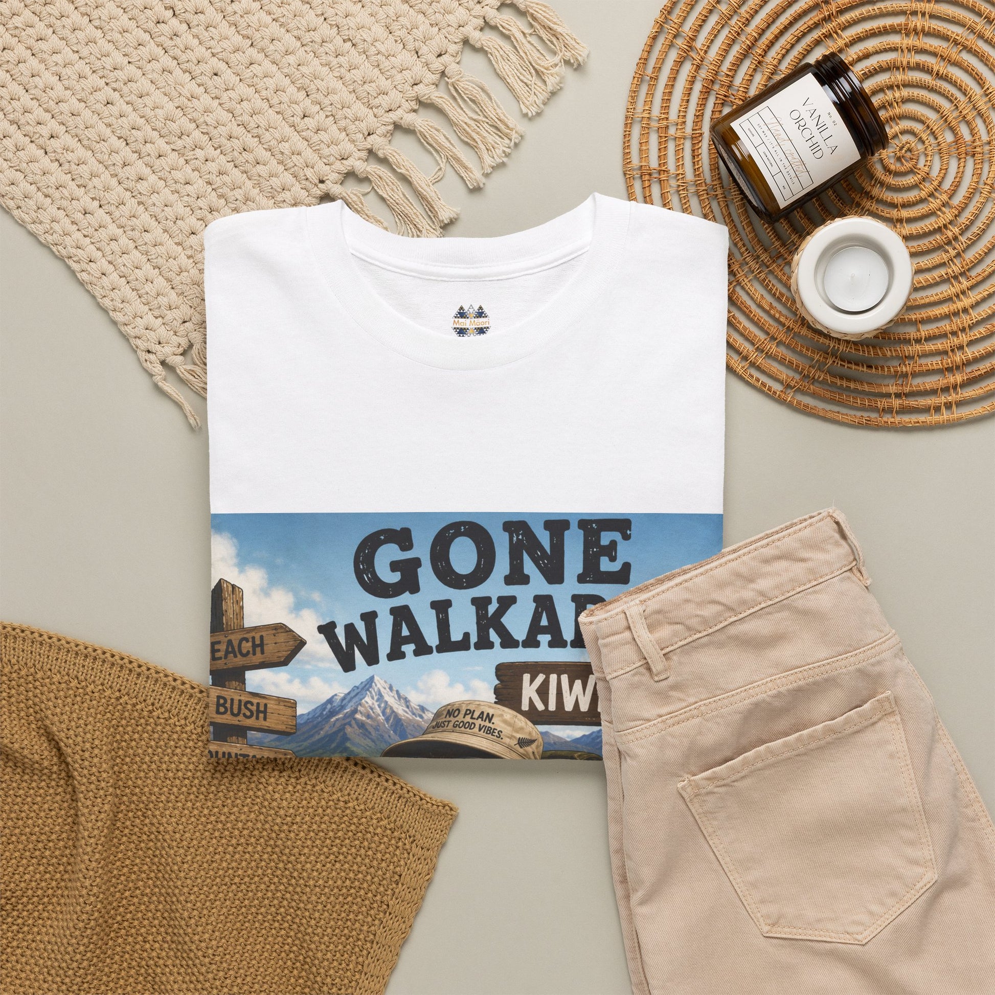 White T-shirt with front kiwi graphic print, shown with other items cropped out