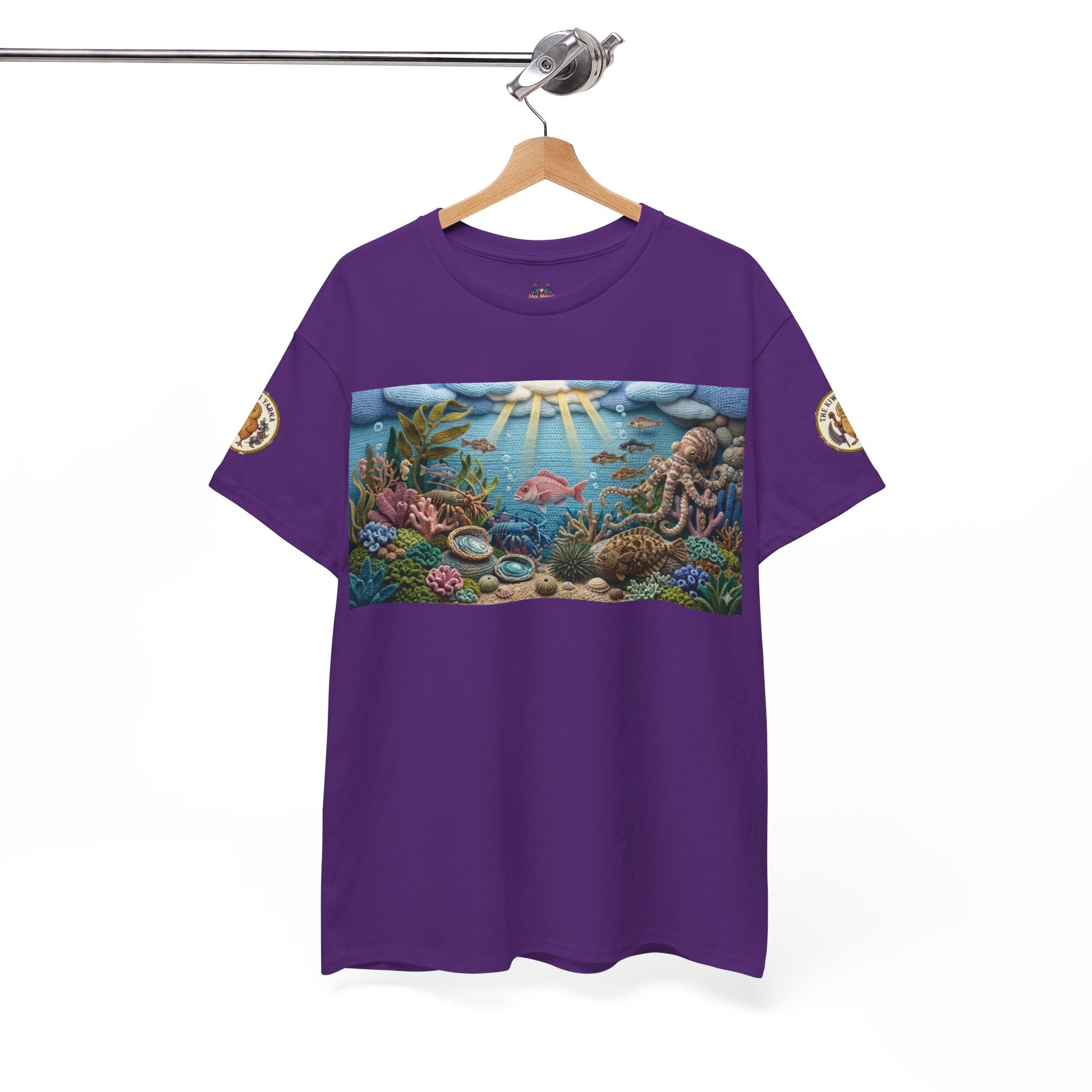 Purple crewneck T-shirt with ocean scene graphic panel and small sleeve patches