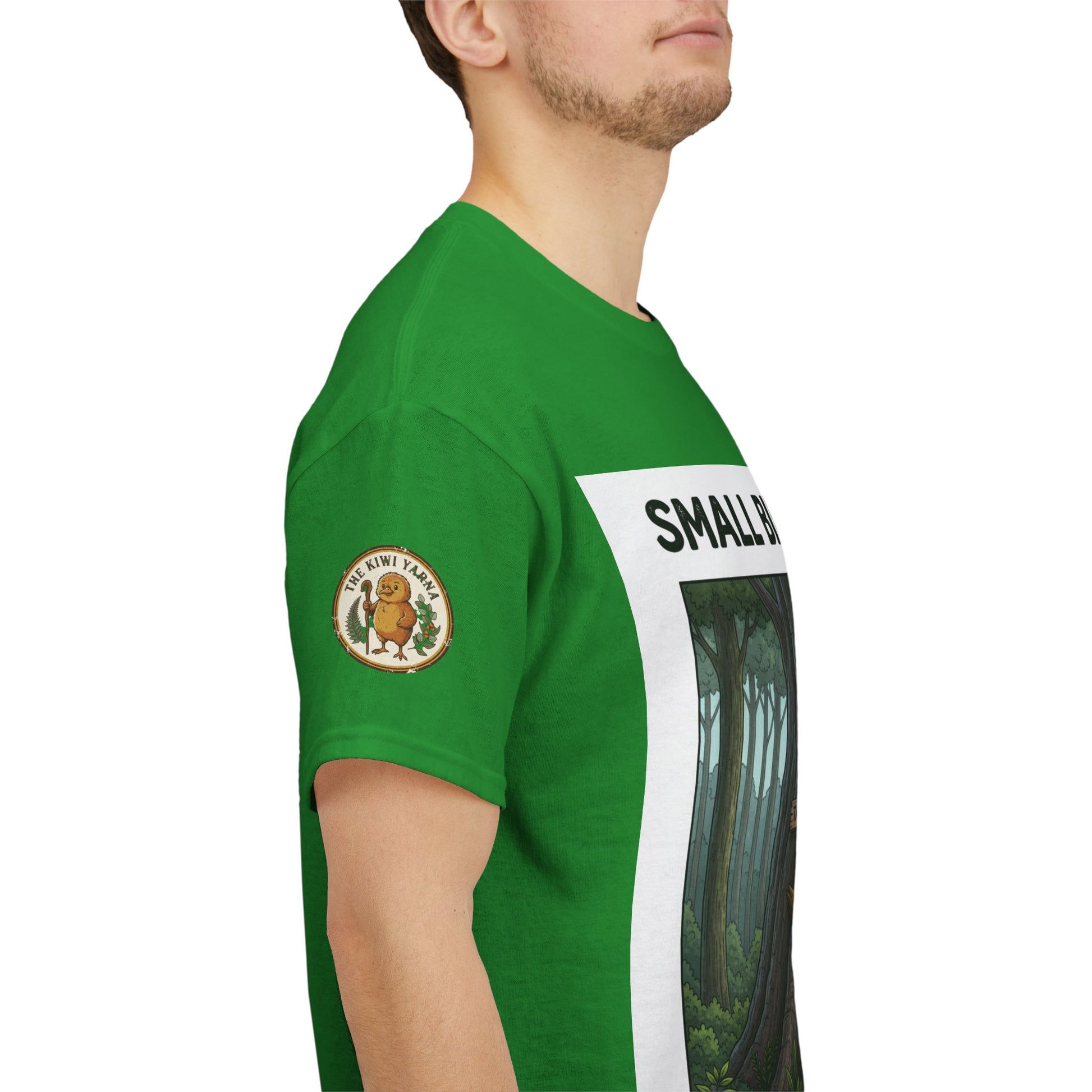 Green crew-neck T-shirt, side view with left sleeve patch and forest panel print