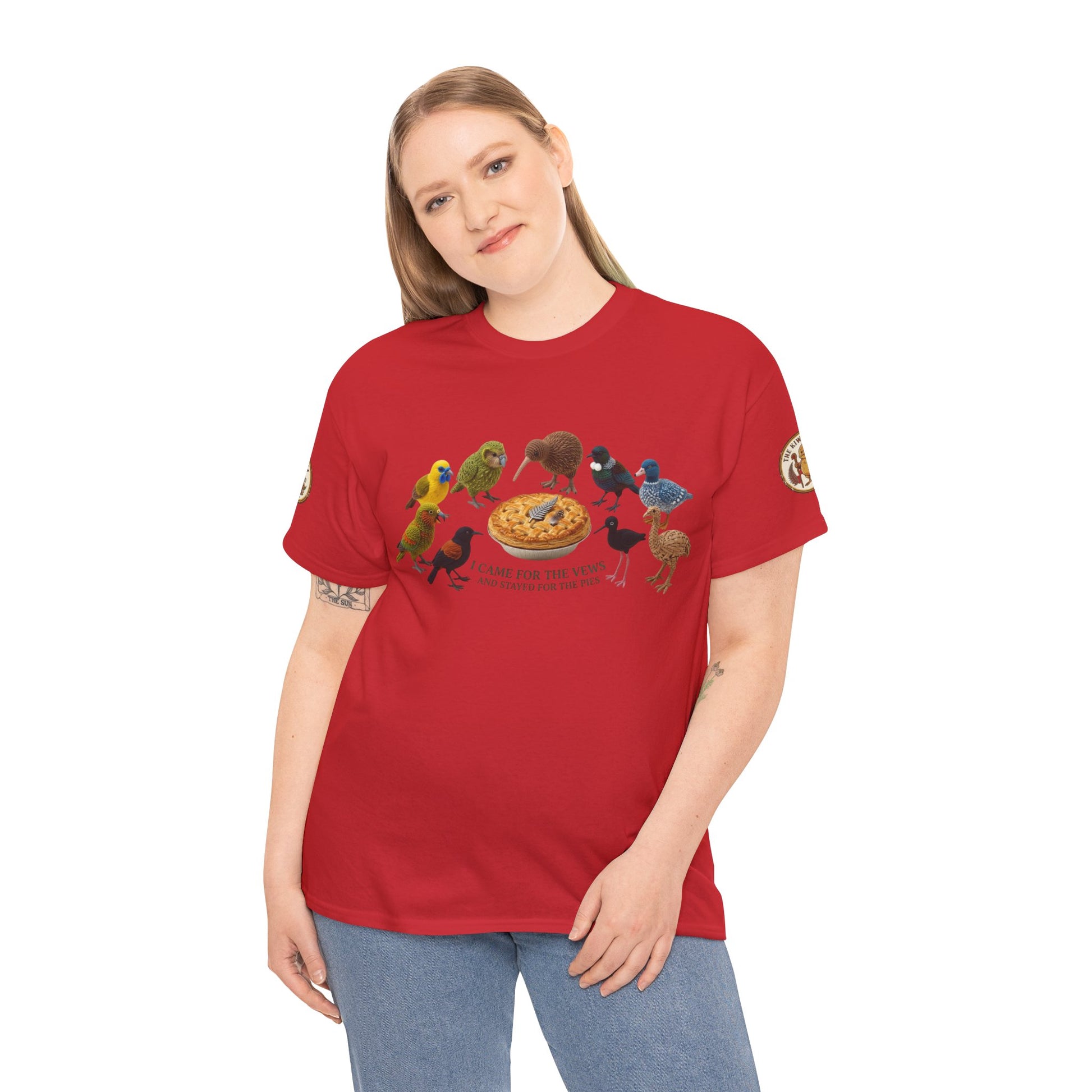 Red graphic T-shirt worn by a person, colorful birds and pizza print on chest