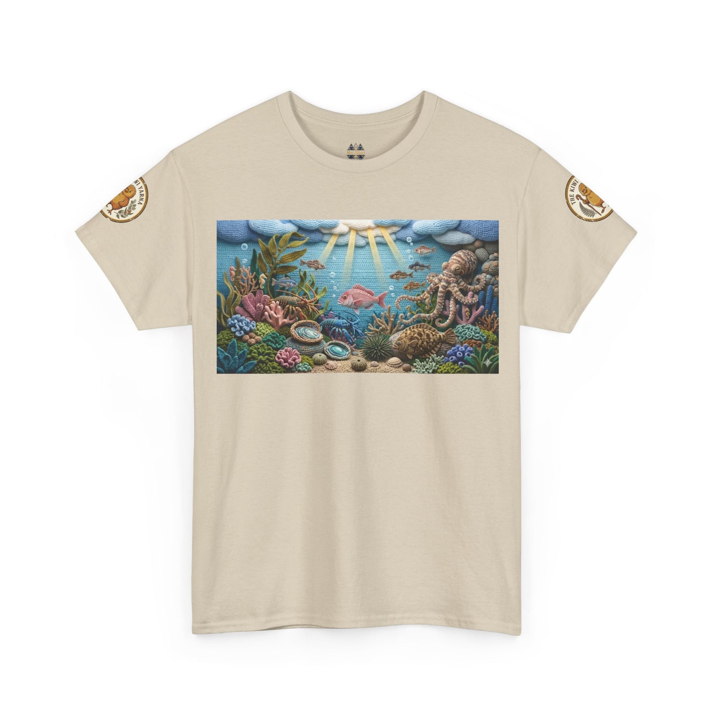 Beige T-shirt with centered underwater reef graphic panel; small circular arm patches.