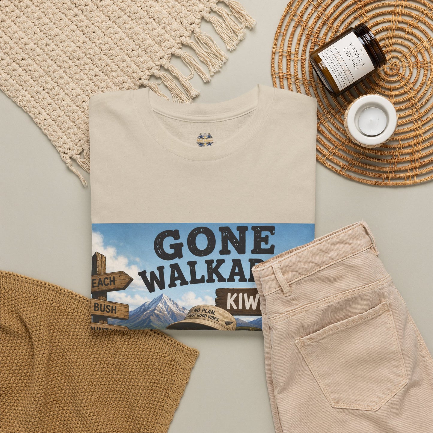 Natural T-shirt with “Gone Walkabout Kiwi Style” front graphic and small chest logo.