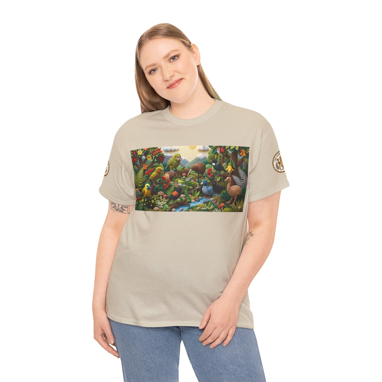 Sand crew-neck T-shirt worn by model; front shows colorful birds-and-forest graphic.