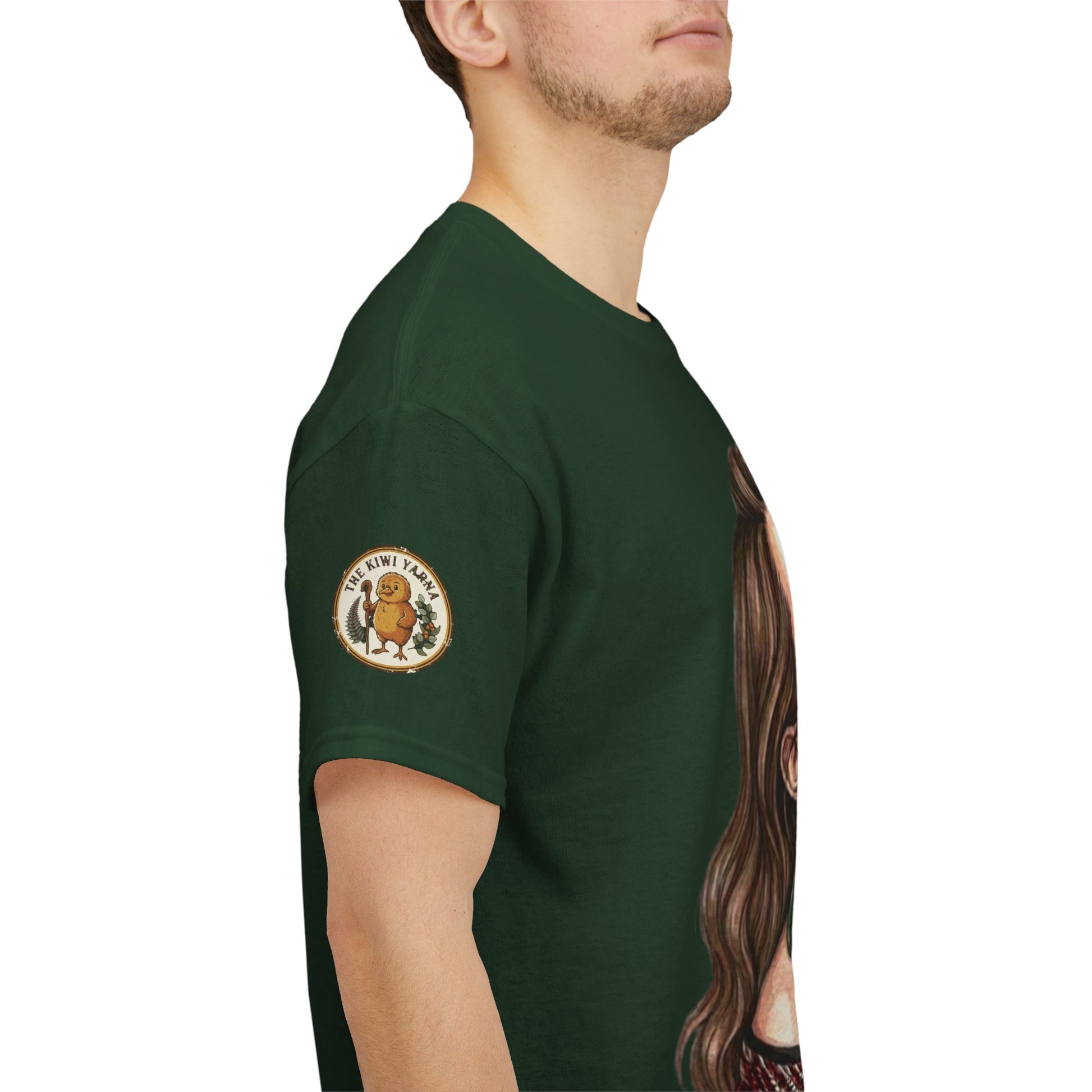 Dark green graphic T-shirt with circular sleeve patch, side view on model.
