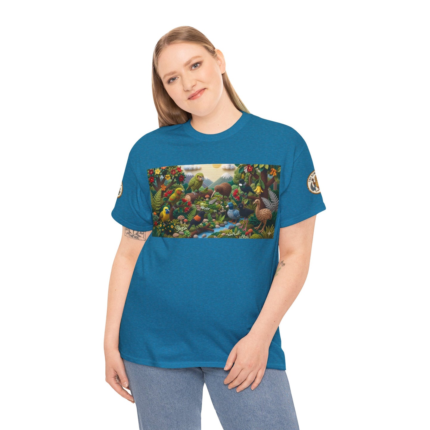 Teal crew-neck T-shirt worn by model with rectangular bird scene graphic