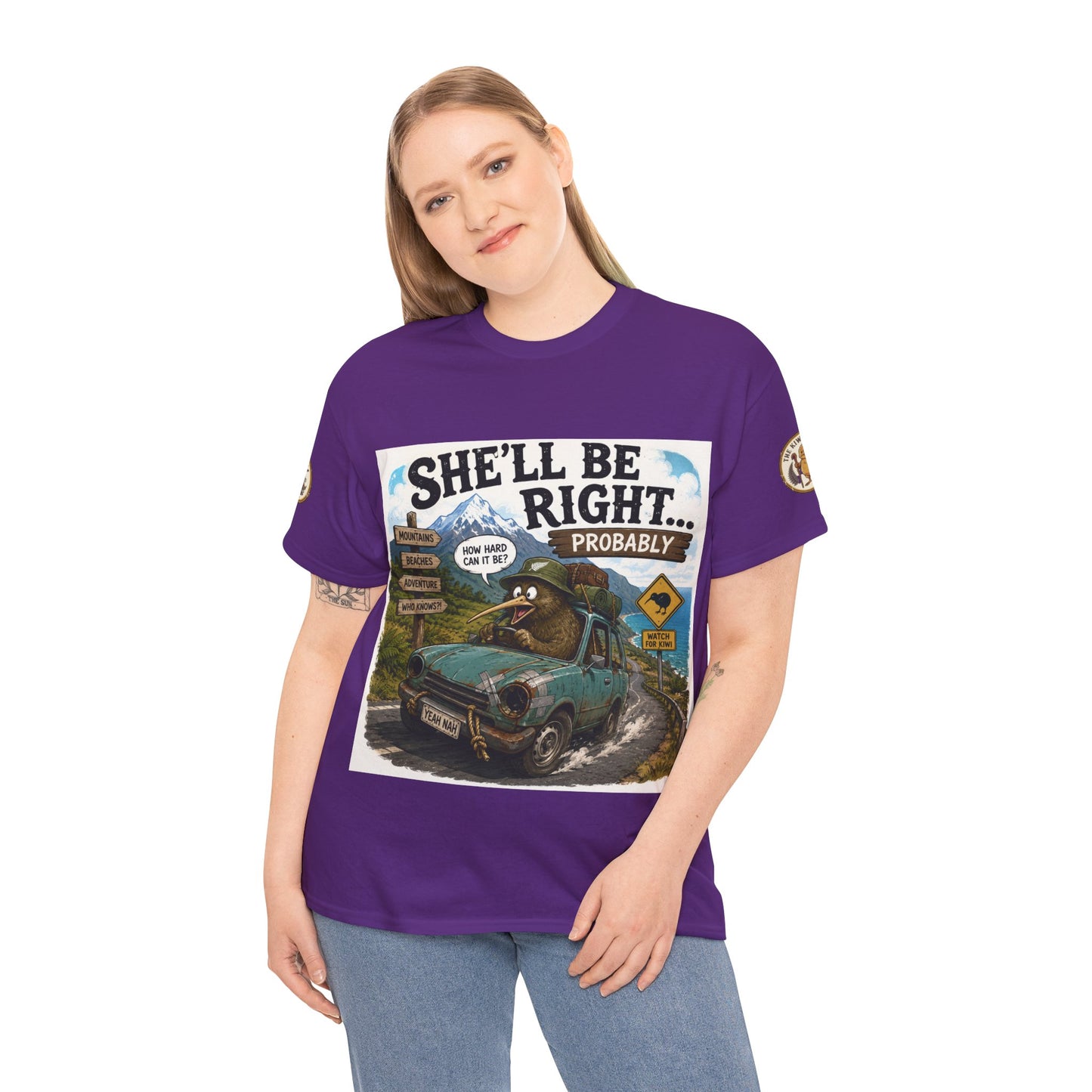 Purple T-shirt worn by model, featuring a large car-and-landscape front graphic