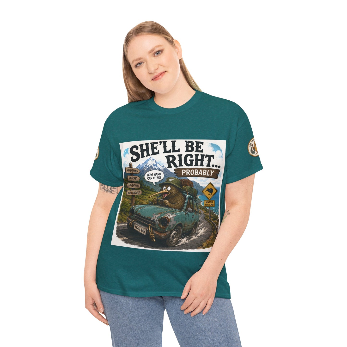 Teal graphic T-shirt on model with centered car scene print and crew neck logo.