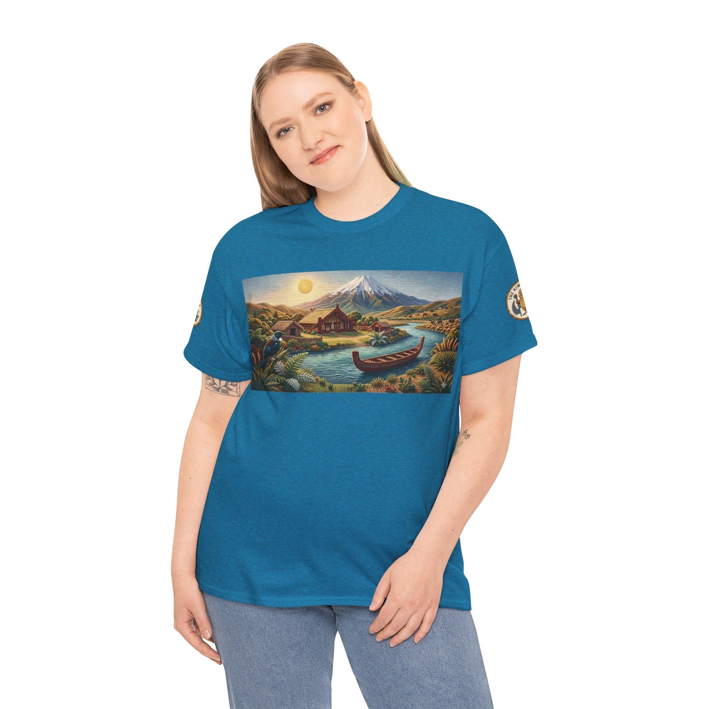Teal short-sleeve T-shirt with front landscape graphic and sleeve emblem patches on model