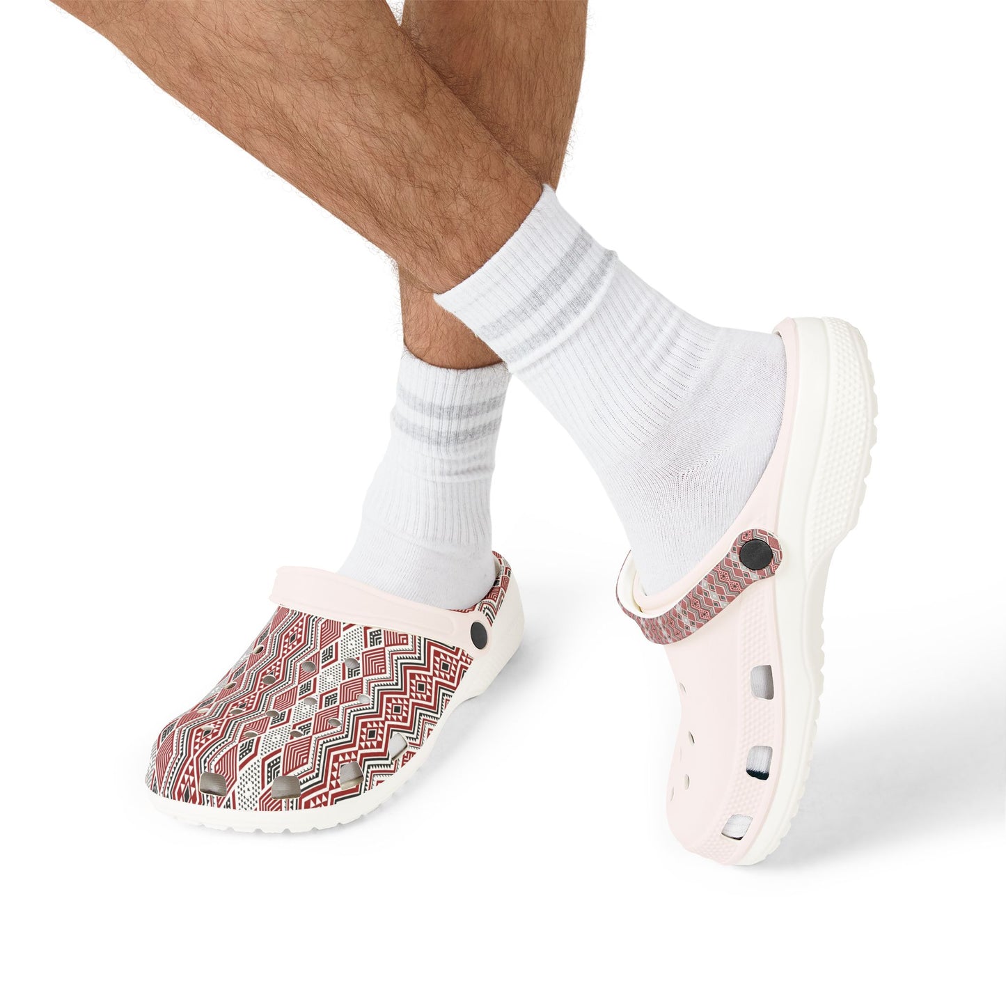 Tāniko clogs worn with white socks; red-and-white patterned upper and perforated footbed