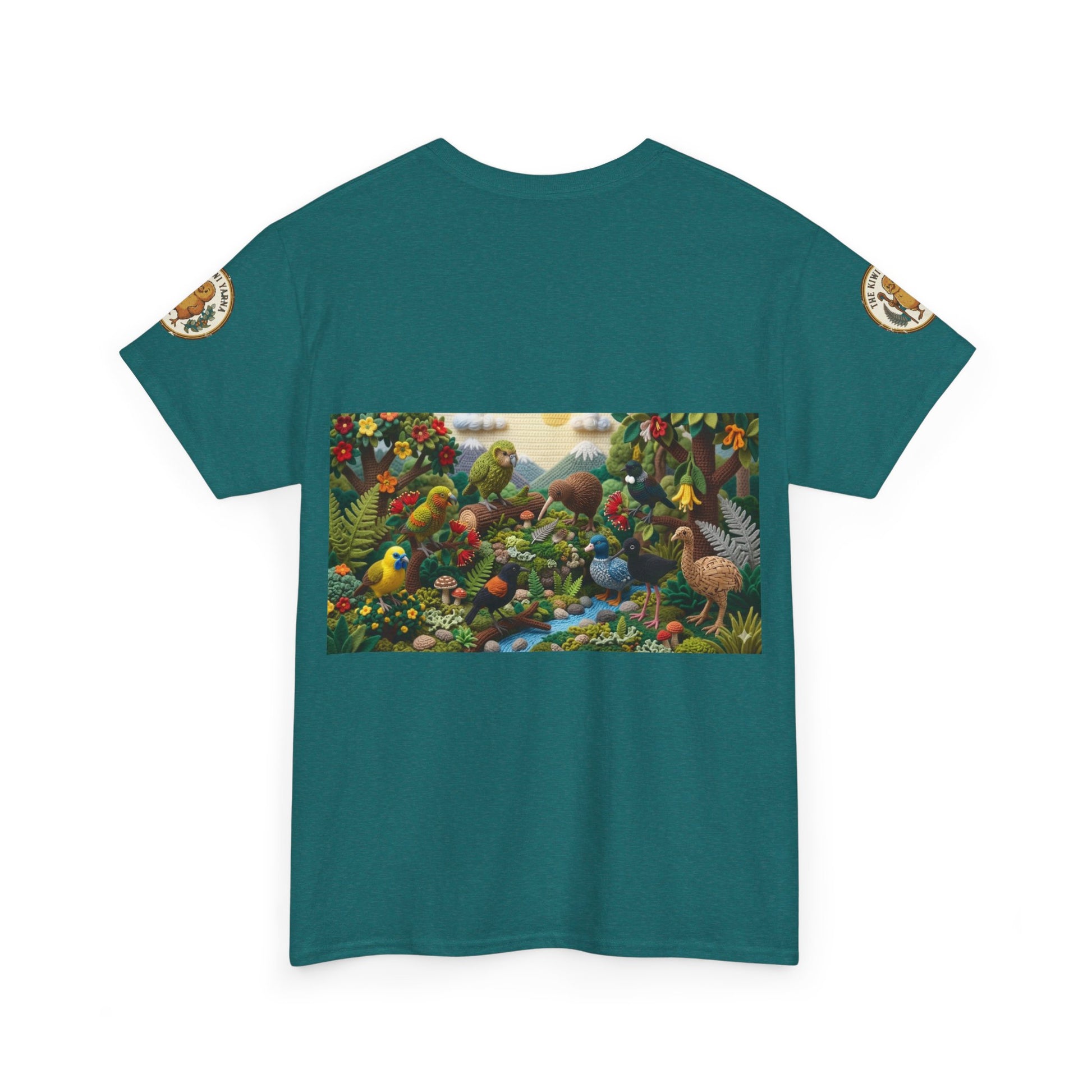 Teal T-shirt laid flat with rectangular bird and woodland scene graphic on front.