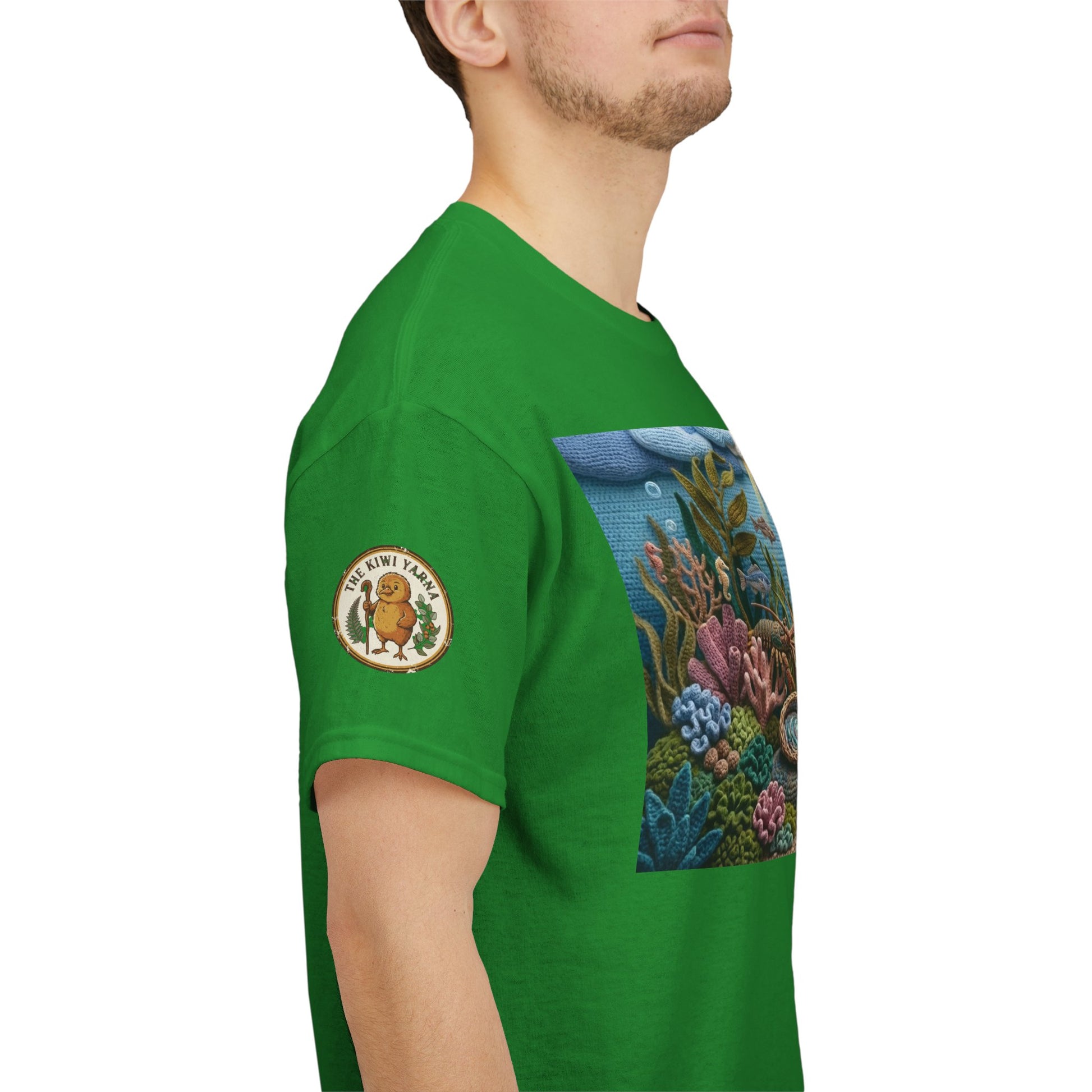 Green short-sleeve T-shirt on a man, with undersea chest graphic and sleeve patch