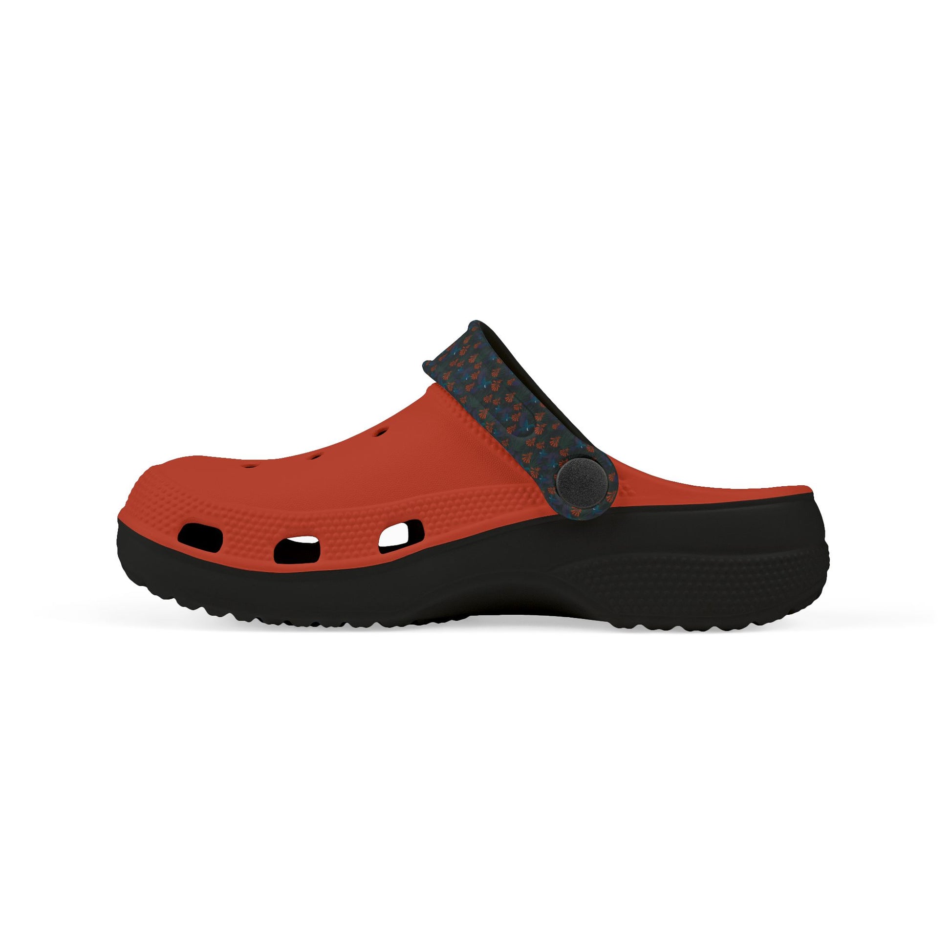 Kids' clog-style casual shoe, profile view, orange slip-on top with dark blue patterned strap