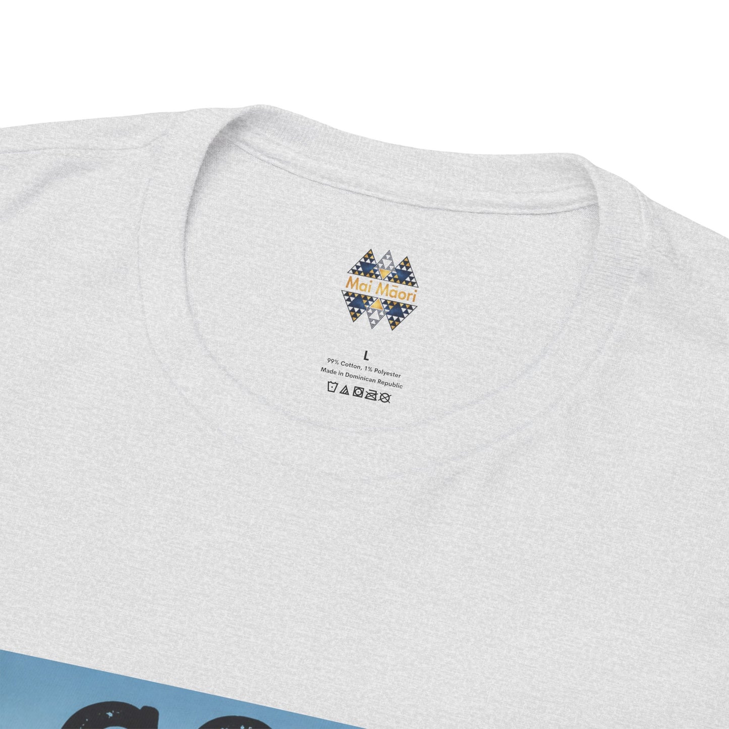 Heather grey T-shirt back close-up with “Mai Moai” label and care icons