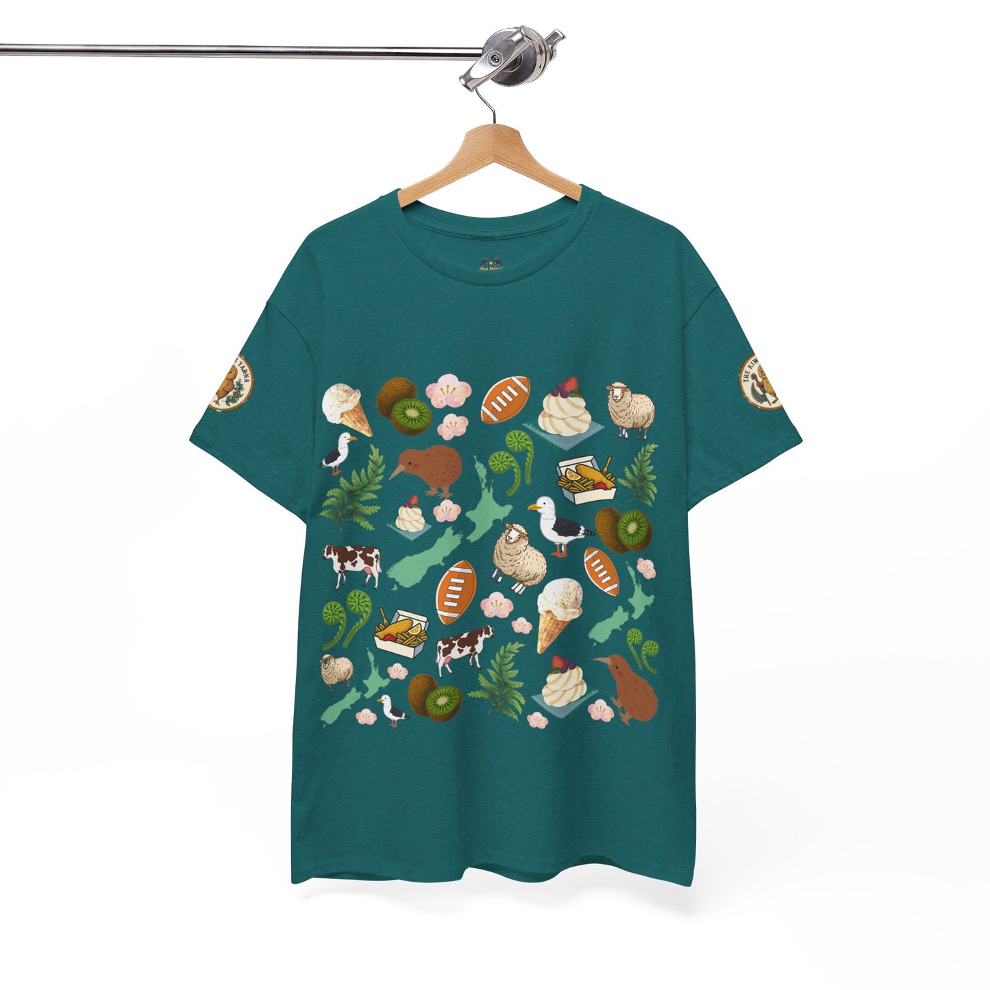 Teal crewneck T-shirt on hanger with scattered Kiwiana-themed icons and animals (front)