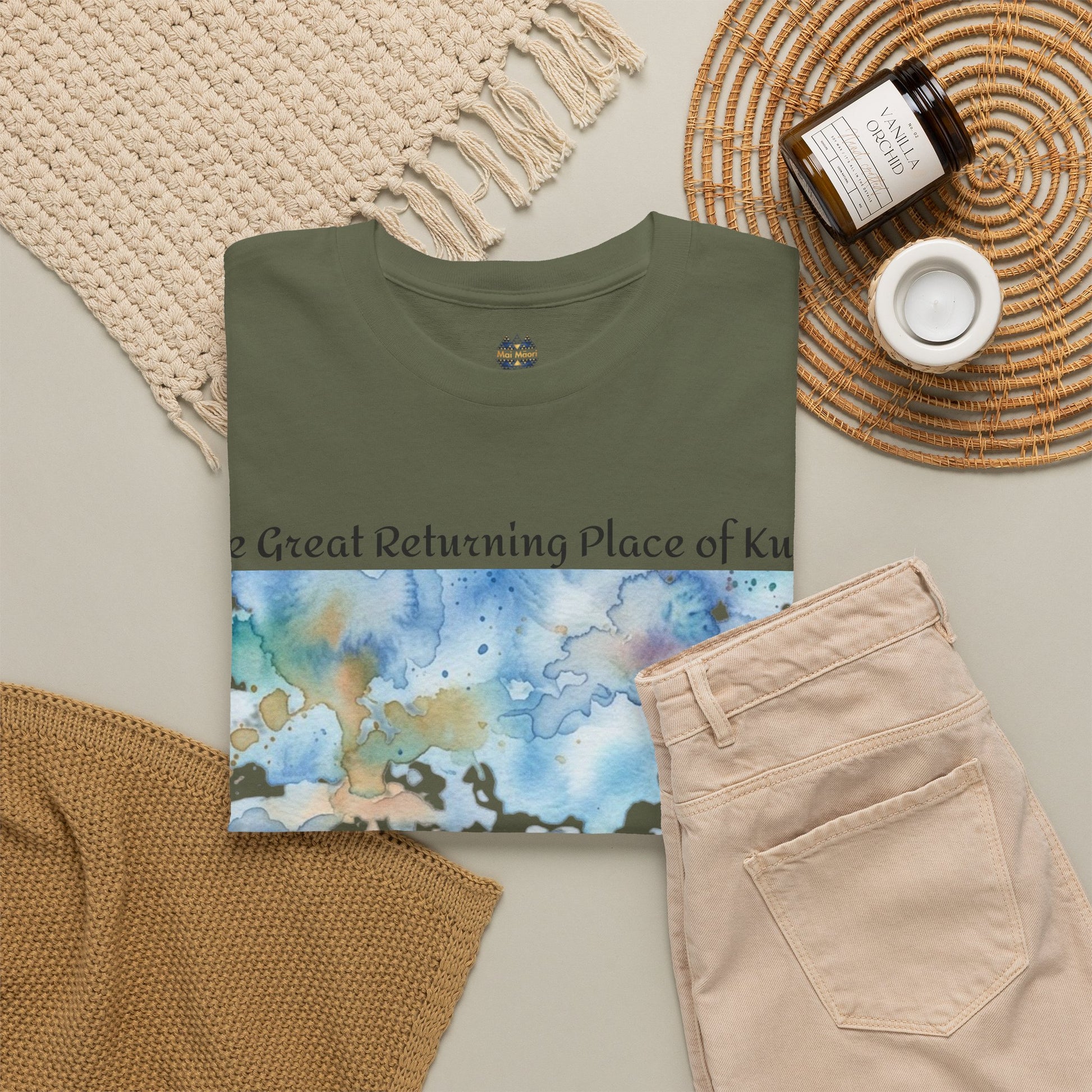 Olive green graphic T-shirt with blue landscape print and crew neckline