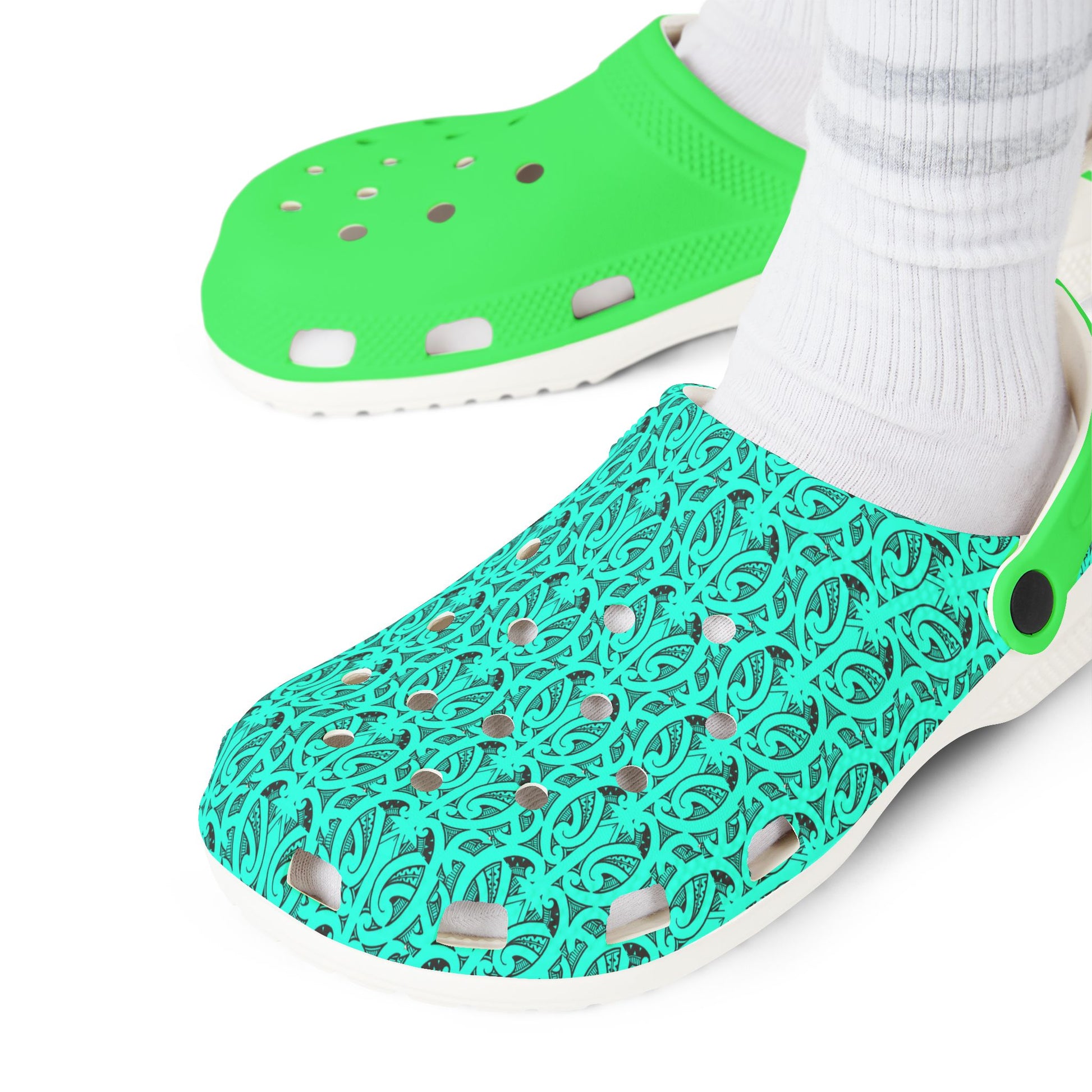 Teal patterned clog with neon green top worn with white socks