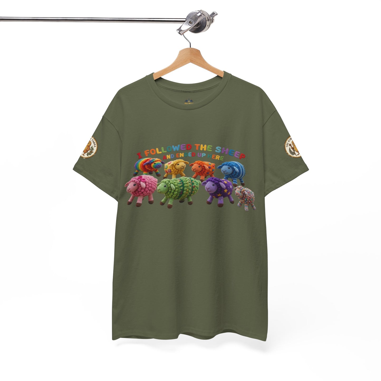 Olive green graphic T-shirt on hanger with sheep lineup and round sleeve patches
