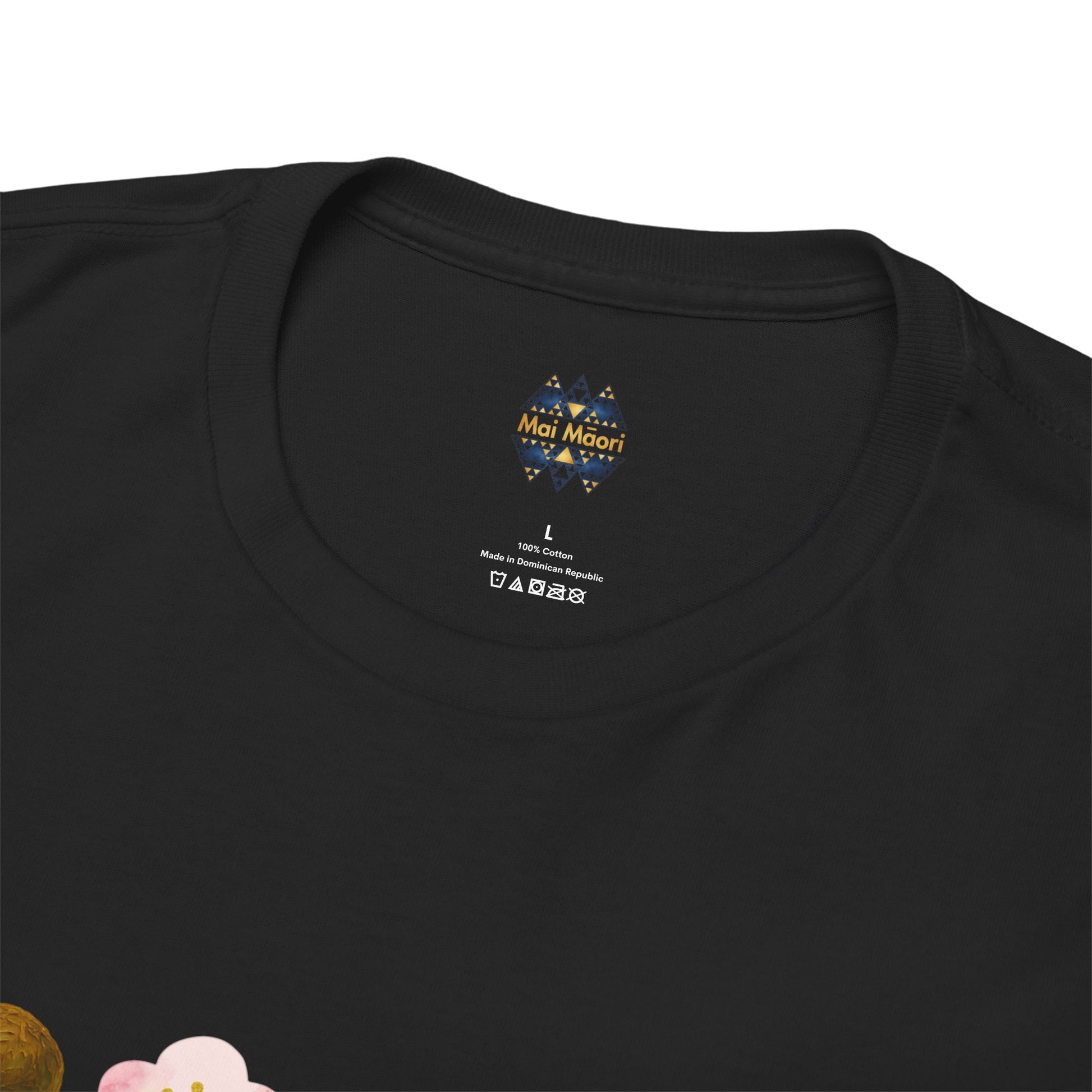 Black T-shirt close-up of neck label print and small chest emblem graphic
