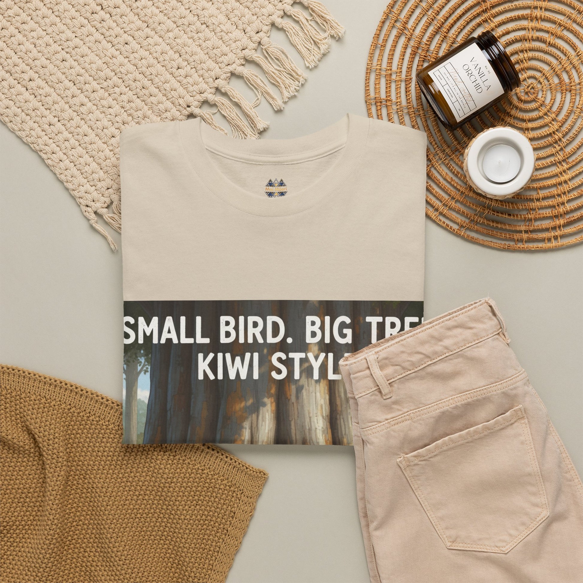 Beige crewneck T-shirt with small chest icon and partial forest graphic print