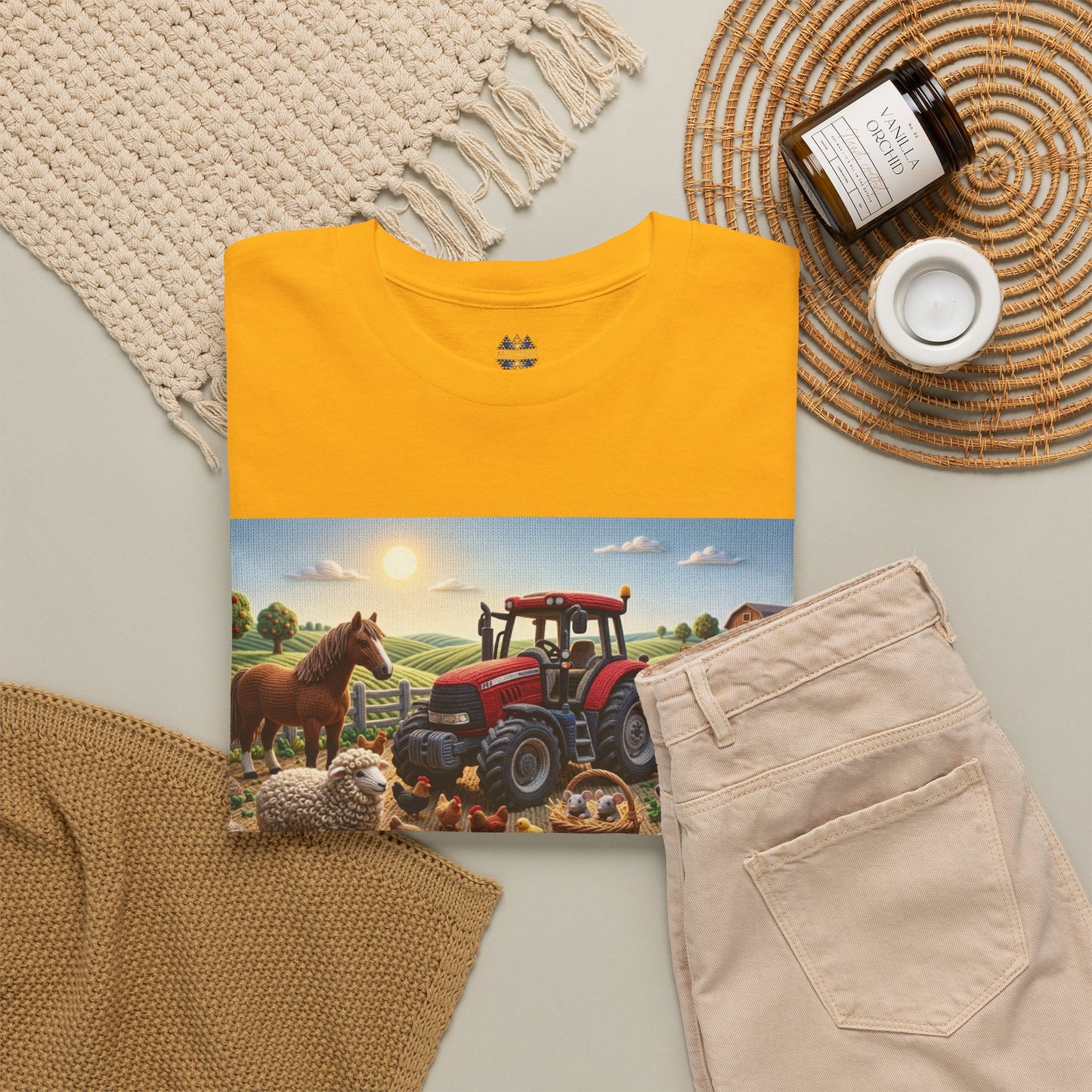 Gold/yellow T-shirt with front farm scene print; crewneck with small emblem above.