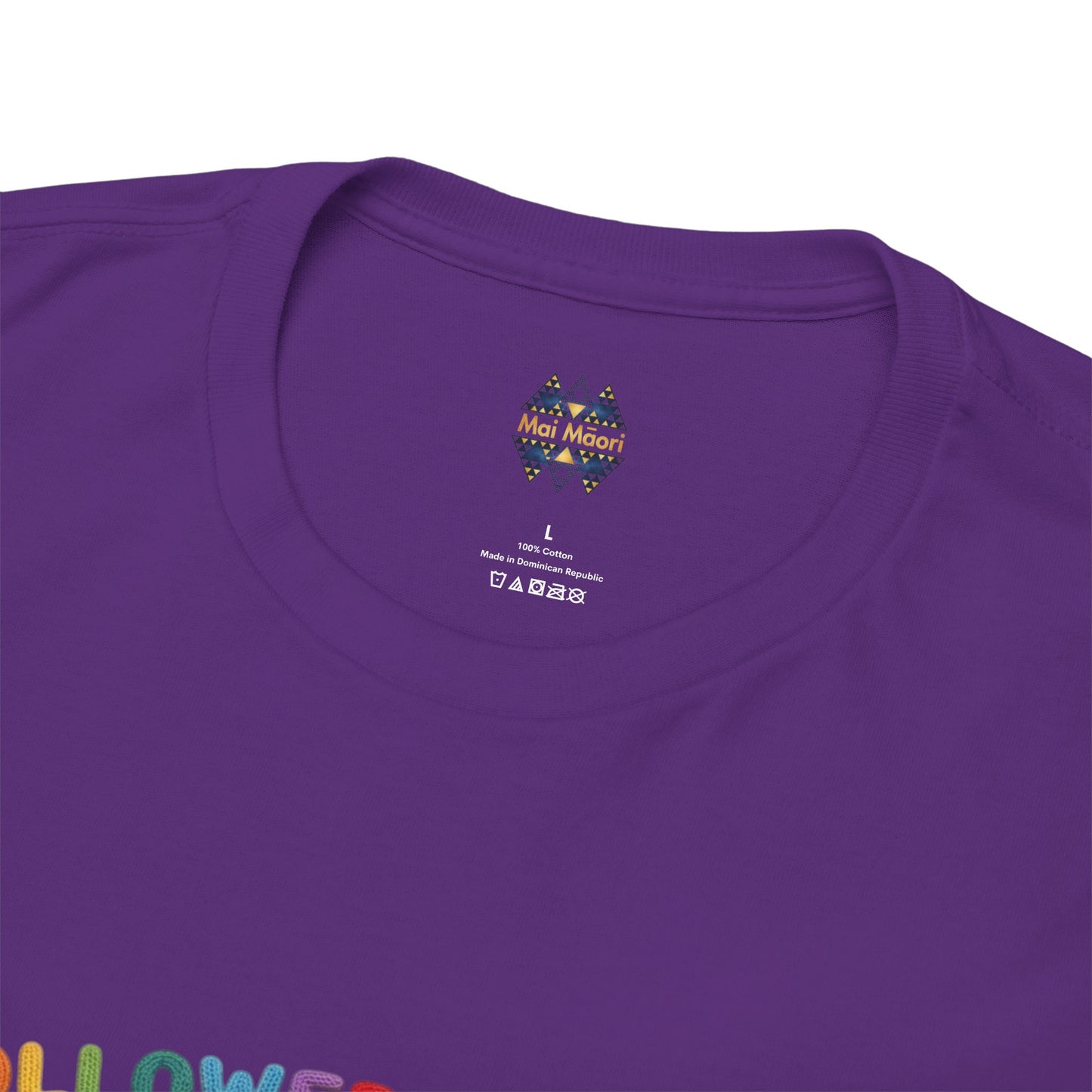Purple t-shirt with small crest logo at chest and printed label near the neckline.