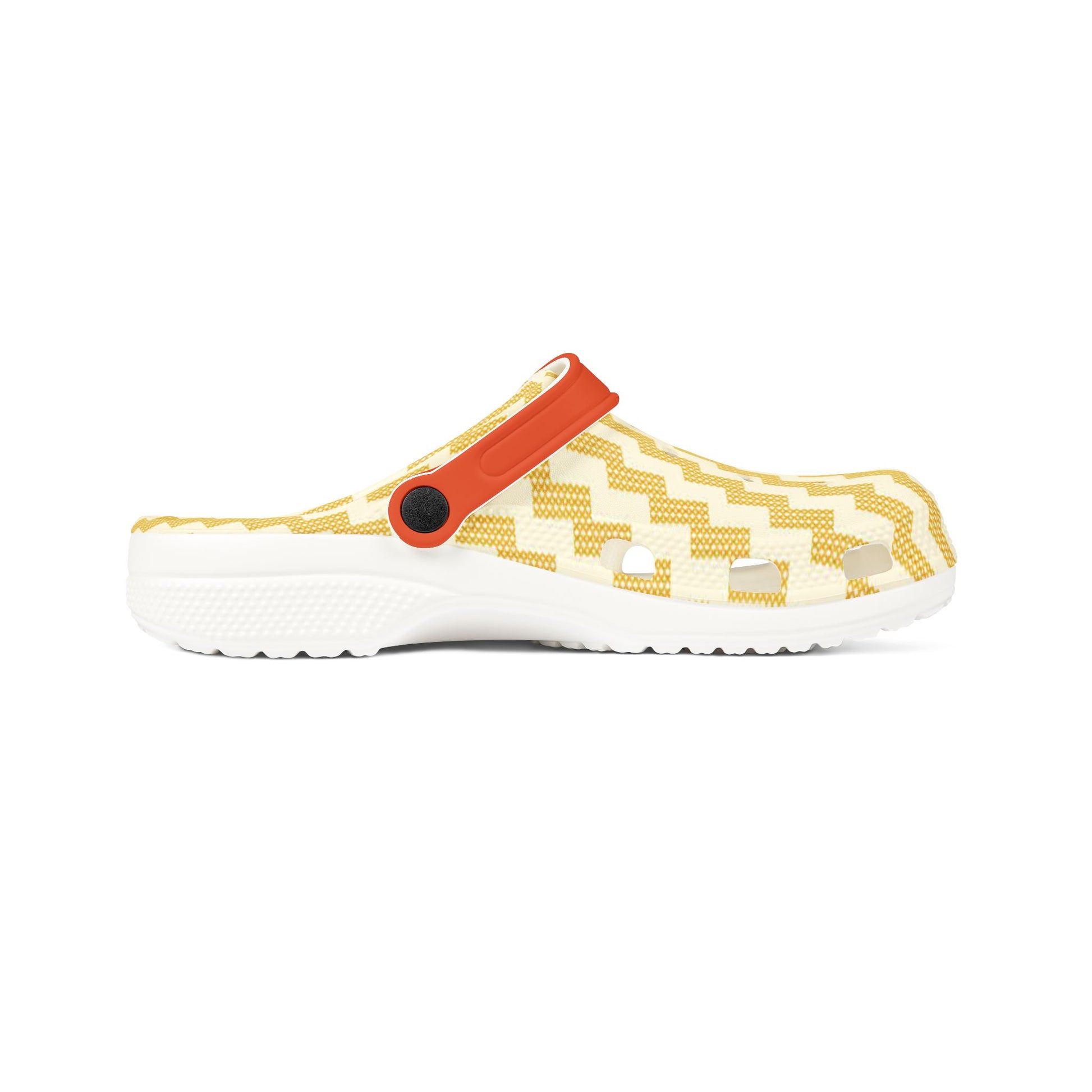 Poutama clogs side view with yellow zigzag upper, orange strap, and white outsole