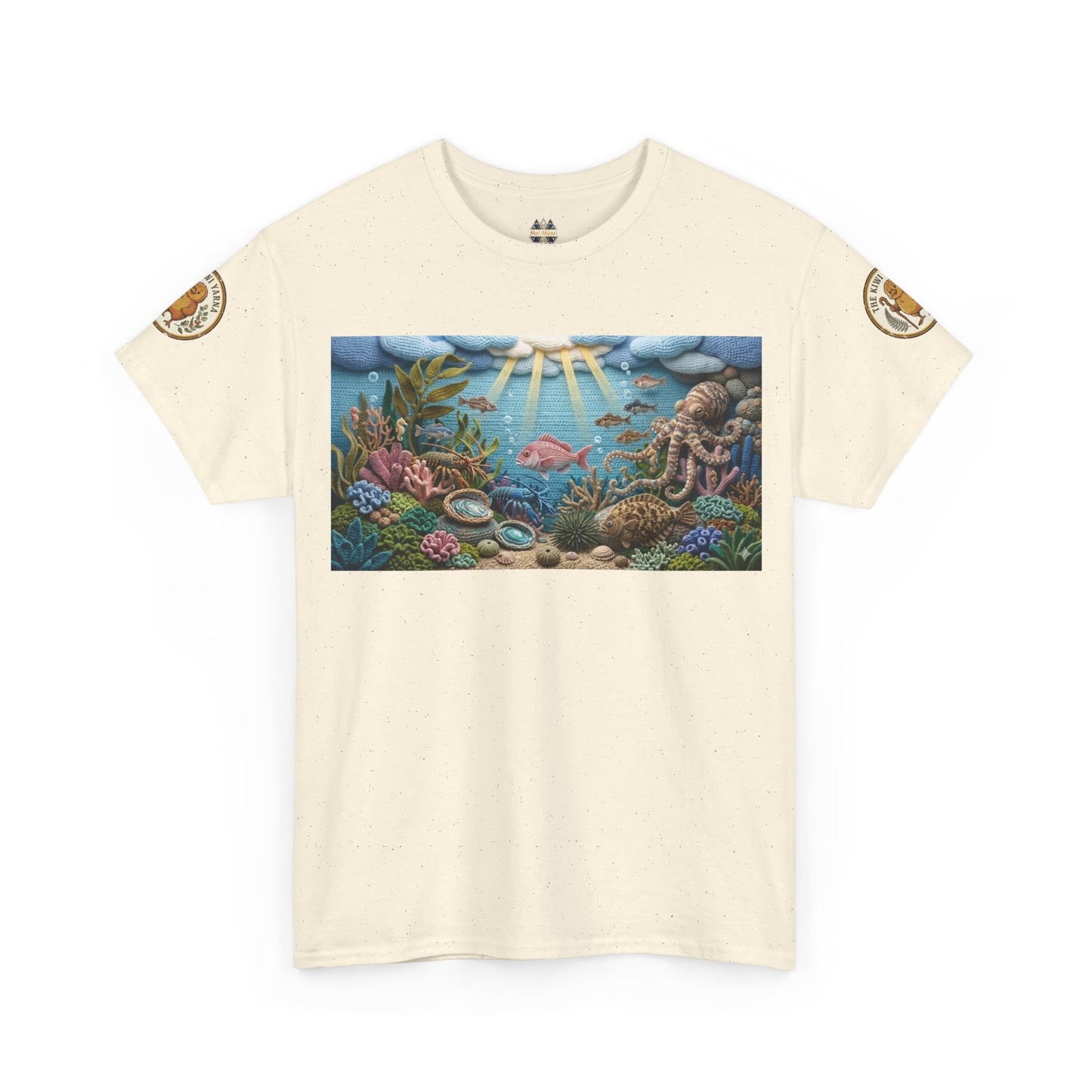 Off-white T-shirt with centered underwater reef graphic panel; small circular arm patches.