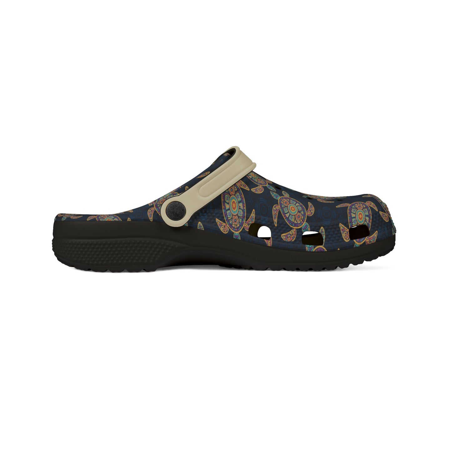 Croc-style clog profile, dark navy turtle print upper with light beige strap and dark sole