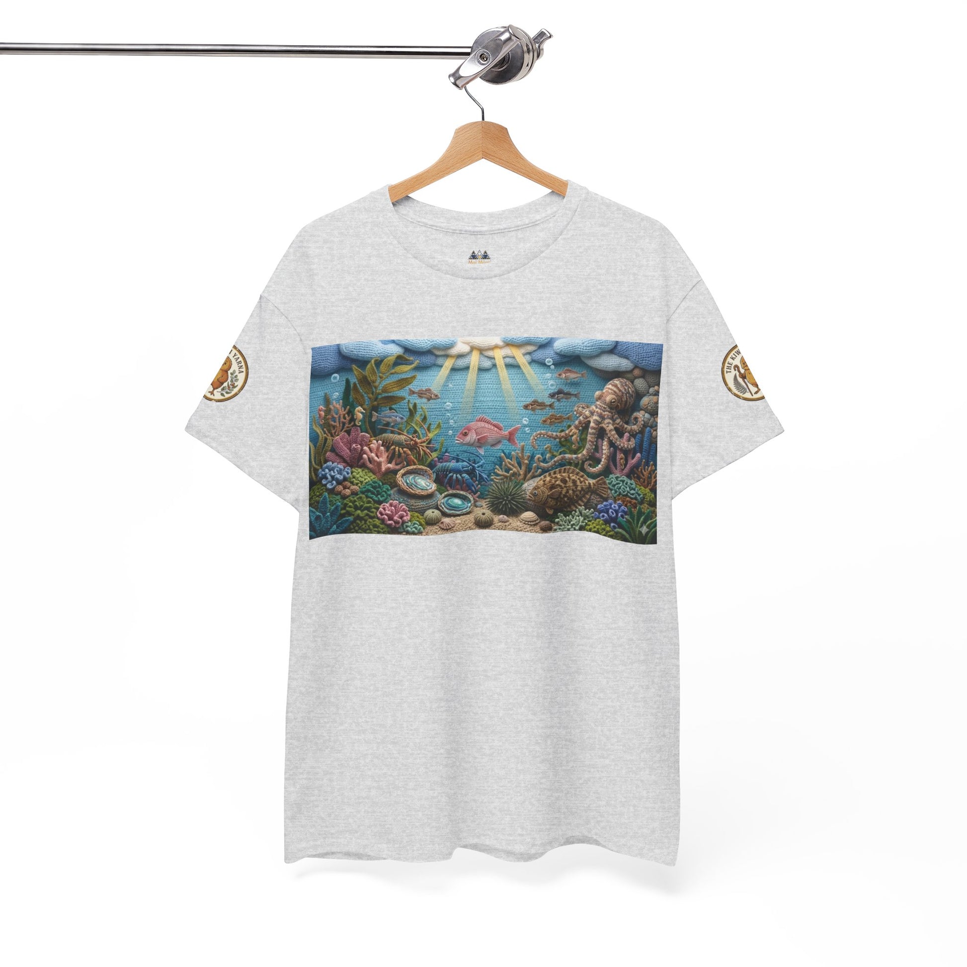 Light gray T-shirt on hanger with rectangular ocean scene print
