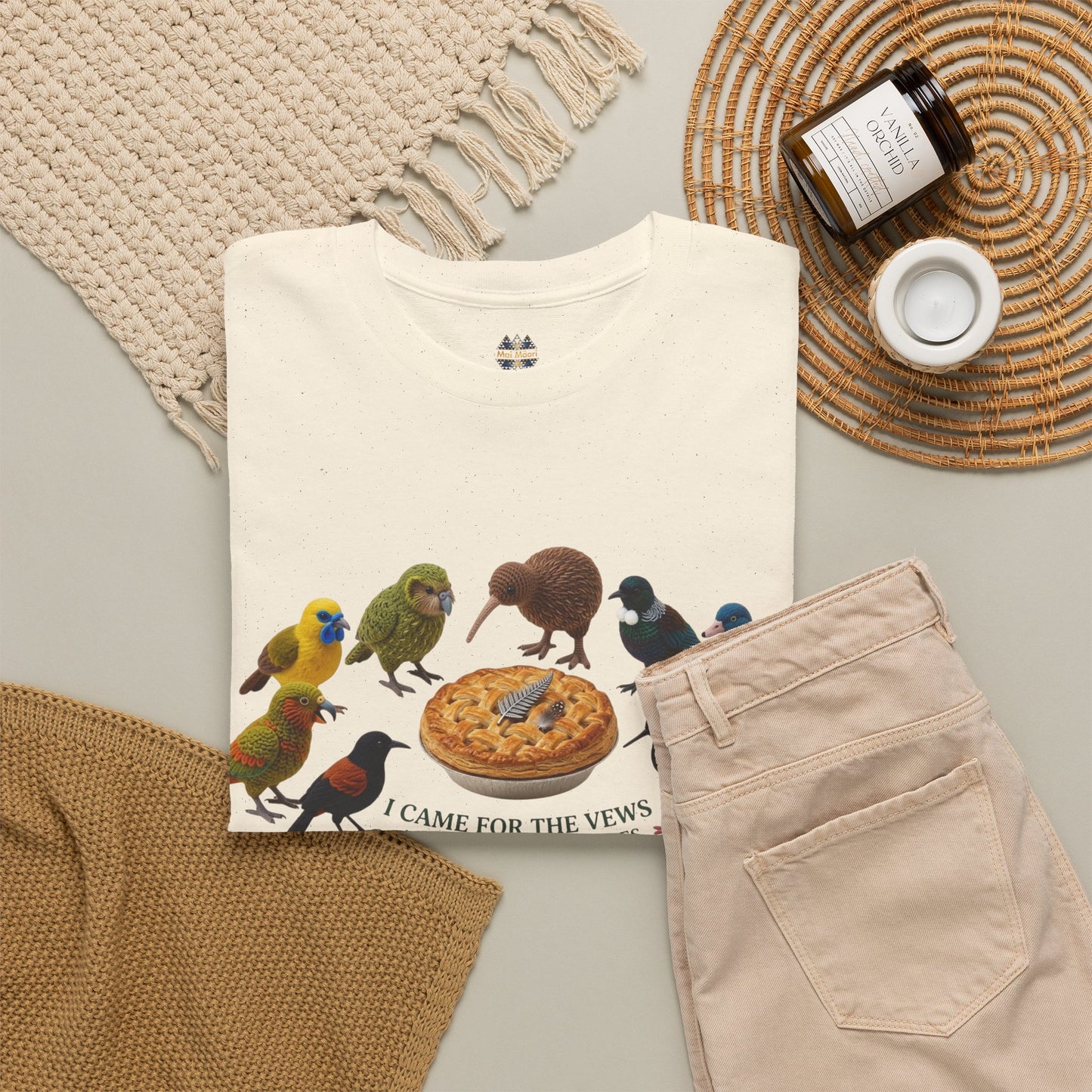 Cream T-shirt with bird and pizza graphic, styled with light beige pants