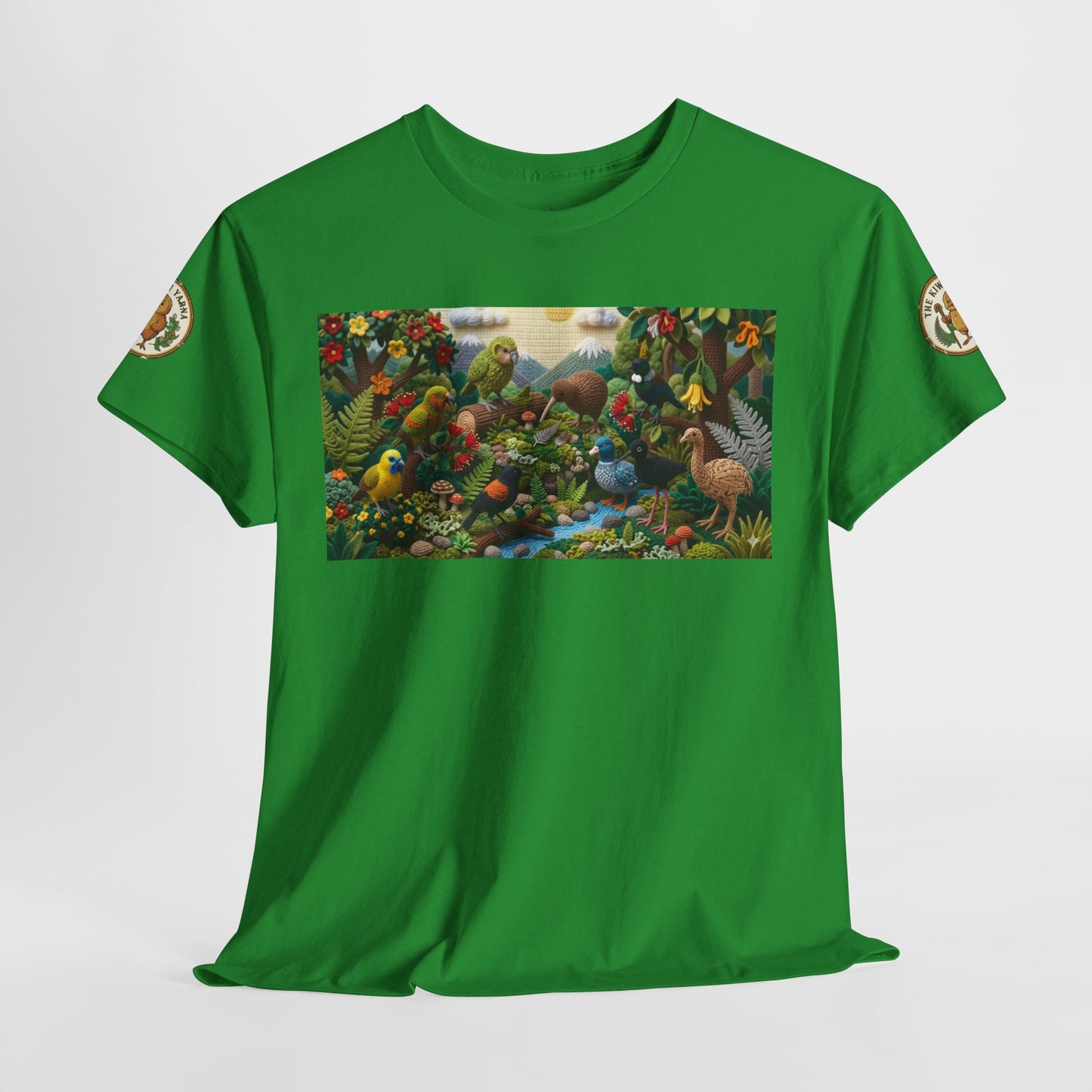 Green T-shirt laid flat with rectangular bird and flowers graphic on the front.
