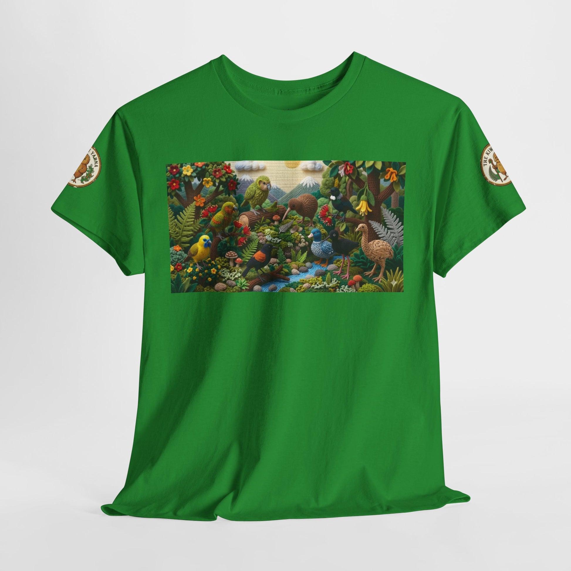 Green T-shirt laid flat with rectangular bird and flowers graphic on the front.