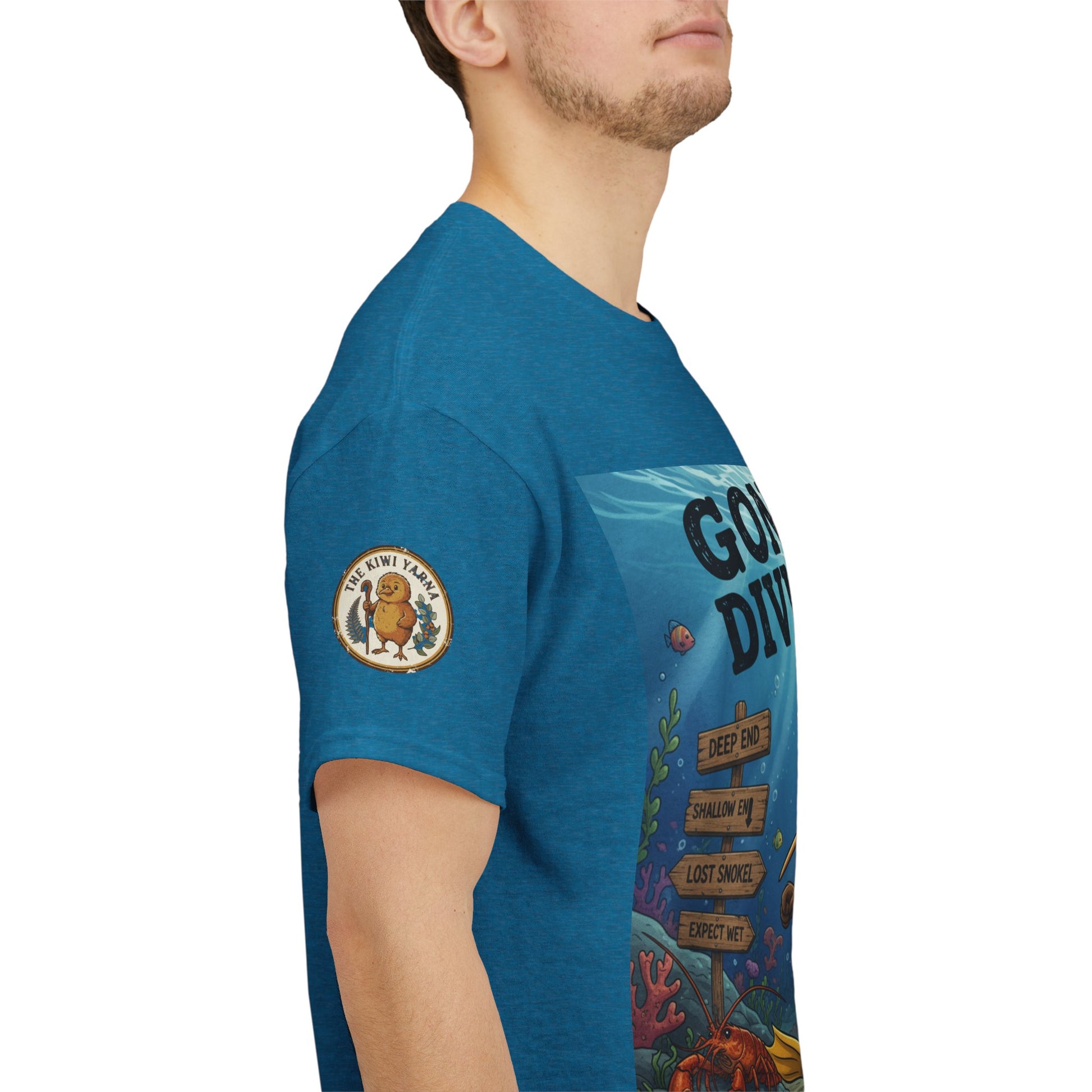 Teal T-shirt side view with left sleeve patch and graphic print