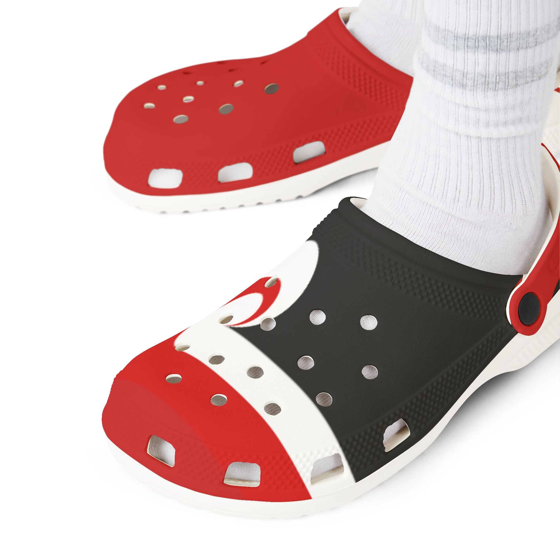 Tino clogs on white socks, red and black uppers with white accent panels