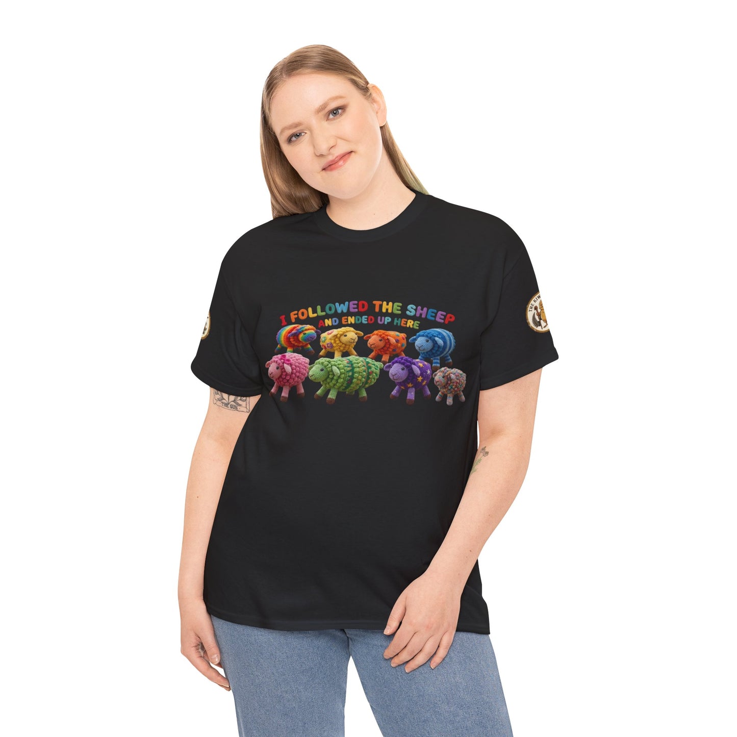 Black graphic T-shirt with colorful sheep illustration, worn by woman